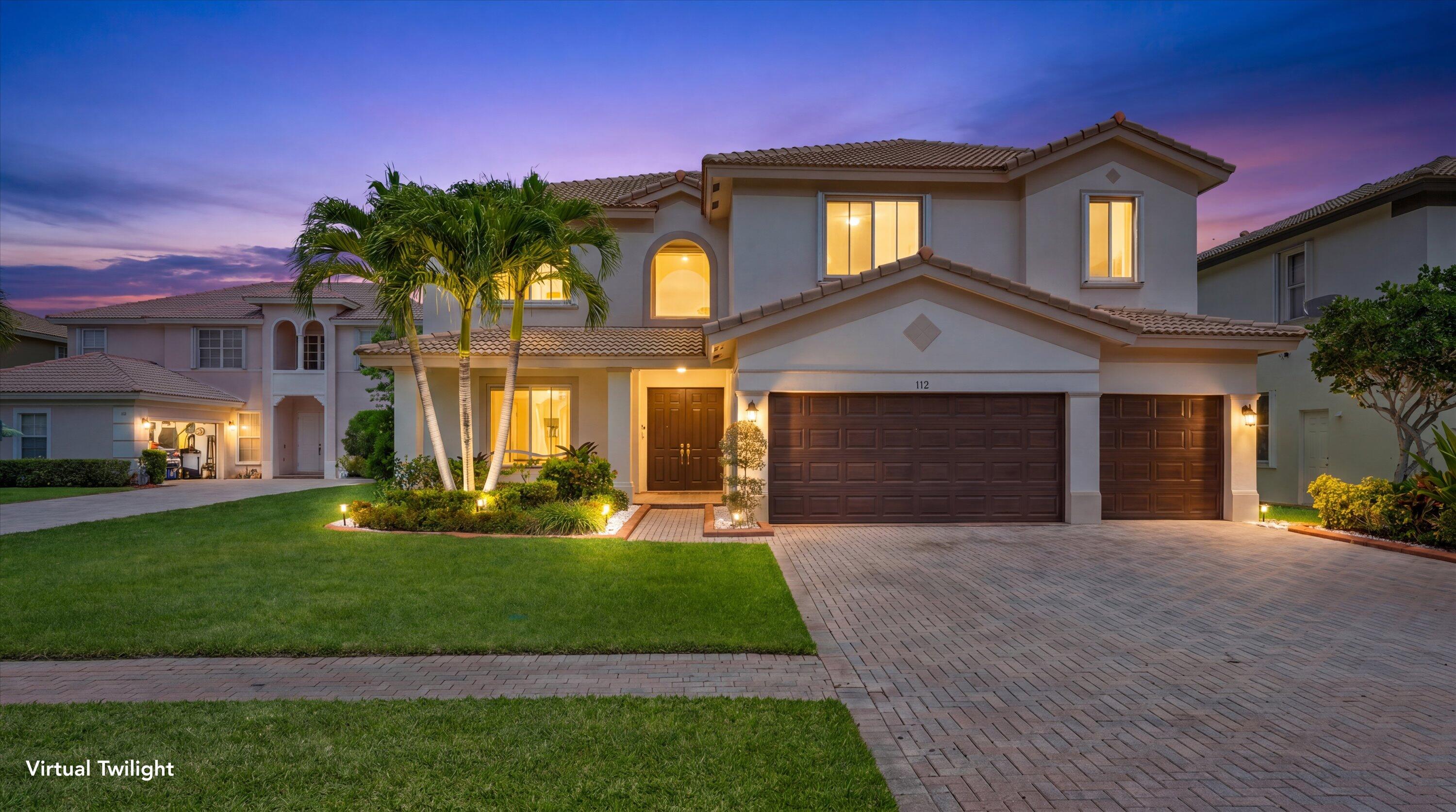 Welcome to a home that truly checks every box for living and effortless entertaining, all set within a gated community. From the moment you enter, you're greeted by an open, airy layout filled with natural light, soaring ceilings, and tranquil lake views that instantly set the tone. The heart of the home is designed for gathering, featuring a spacious, updated kitchen with granite countertops and stainless-steel appliances that flows seamlessly into the main living areas. The first-floor primary suite offers both privacy and comfort, complete with a beautifully updated bathroom featuring dual sinks, a Roman tub, and a separate shower. Upstairs and throughout the home, you'll find incredible flexibility with 5 spacious bedrooms plus a large extra room currently set up as a private  movie theater, easily functioning as a 6th bedroom. A second-floor loft adds even more space for a playroom, office, or additional lounge area. With 3 full bathrooms and a powder room, the layout is ideal for both everyday living and hosting guests. Step outside to your covered lakefront patio, perfect for outdoor dining and relaxing evenings overlooking the water. Situated on a large lot at the end of a cul-de-sac, the home also features a 3-car garage and an expansive paver driveway. Residents of Bella Terra enjoy resort-style amenities just moments away, including a fully equipped fitness center, heated pool with party area, lighted tennis and basketball courts, a children's playground and pool, and a barbecue area, bringing the lifestyle full circle
