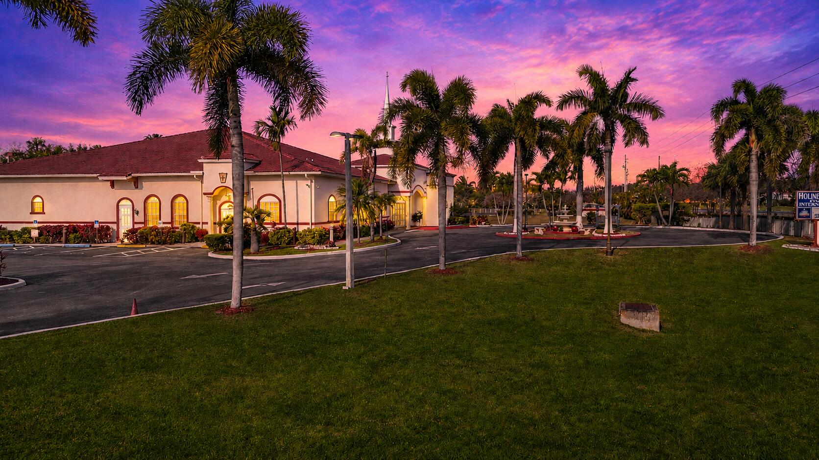 This stunning 8,644 SF building is situated on a meticulously landscaped 4.91-acre property with over 1,000 feet of frontage on Hypoluxo Road. Approximately 3.5 acres are fully fenced, providing added security. Built in 2011, the facility is thoughtfully designed and includes a main sanctuary, fellowship hall, prep kitchen, offices, Sunday school rooms, a mezzanine, a lobby, and multiple lavatories, including separate men's and ladies' facilities along with two additional restrooms. The property offers ample parking for 70+ vehicles, with additional space available for expansion. A previously approved Phase 2 plan allows for an additional 20,000 SF building, presenting a great opportunity for future growth. The building is equipped with modern amenities, including security cameras, a burglar alarm system, an acoustical ceiling, a fire sprinkler system, a high-quality sound system, and a combination of carpet, laminate, and concrete flooring.  The exterior grounds are equally impressive, featuring a circular driveway, concrete sidewalks, parking lot lighting, and beautifully maintained palm trees that enhance the overall aesthetic of the property.