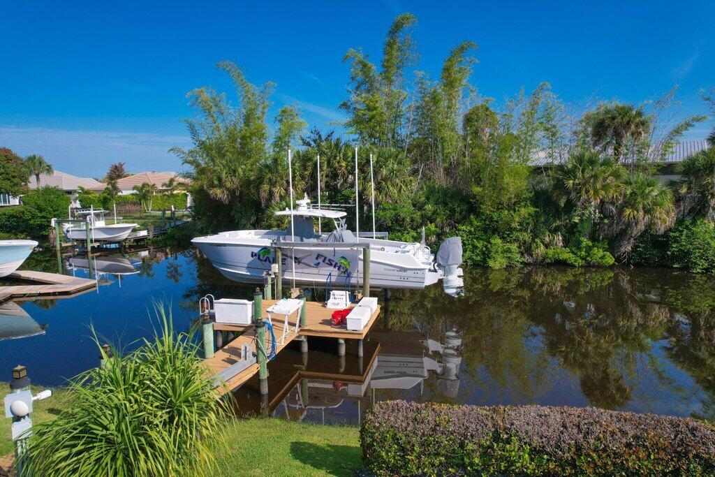 Welcome to this waterfront single-story residence in Lost River Manors, Stuart, offering 2,568 square feet of finished living space designed for comfortable everyday living. This four-bedroom, three-bathroom home provides ample accommodation with a three-car garage for convenient parking and storage. Positioned on a waterfront lot, the property captures the appeal of water access while maintaining the practicality of a single-level floor plan that eliminates stairs and maximizes accessibility throughout the home. The thoughtful layout of four bedrooms and three full baths ensures flexibility for various living arrangements and guest accommodations. BRAND NEW A/C INSTALLED ON JUNE 3, 2026 Community is getting ready for gated entrance!