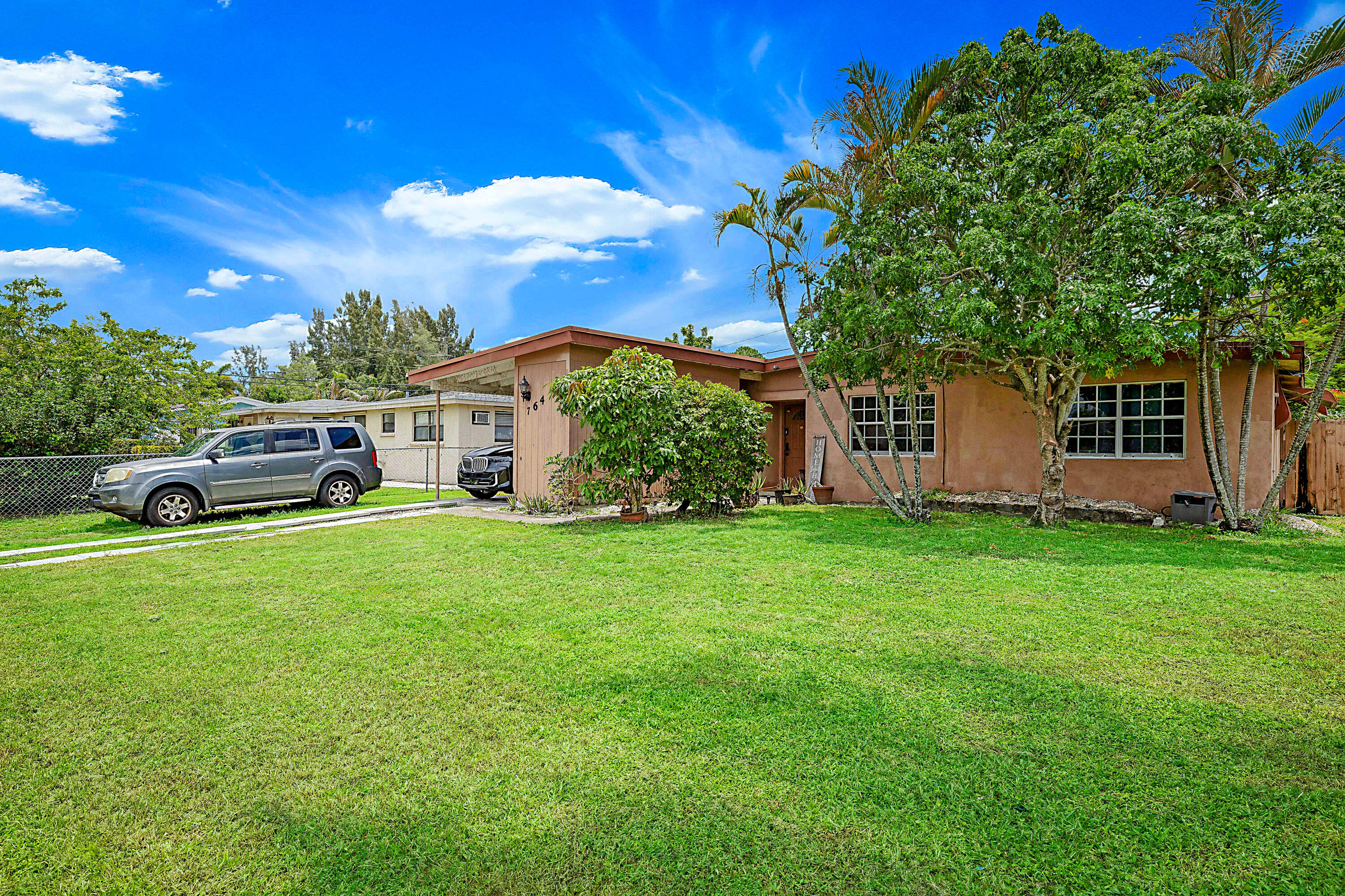 Welcome to this waterfront single-story home nestled in Royal Palm Beach. This three-bedroom, two-bathroom residence offers 1,158 square feet of comfortable living space designed for modern convenience. The canalfront location provides a distinctive setting that enhances the appeal of the property.  Open kitchen to family room for entertaining.  The best value home in Royal Palm.