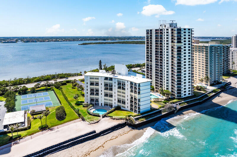 Sea Dunes 7B - Direct Oceanfront Singer Island oceanfront condo offering luxury beachfront living in a fully renovated 2-bedroom, 2-bath residence—an exceptional investment property with current tenants in place generating over $60,000 annually.  Located in a boutique oceanfront building with only 32 residences, this turnkey condo offers immediate income and long-term potential. Features include a new kitchen, updated bathrooms, spacious primary suite, and direct ocean views. Amenities include a heated beachfront pool, clubhouse, and covered parking.  The building has received developer interest up to $48 million (approx. $1.5M per unit), highlighting the value of this prime location.  Ideal as an investment, vacation rental, seasonal retreat, or full-time residence.