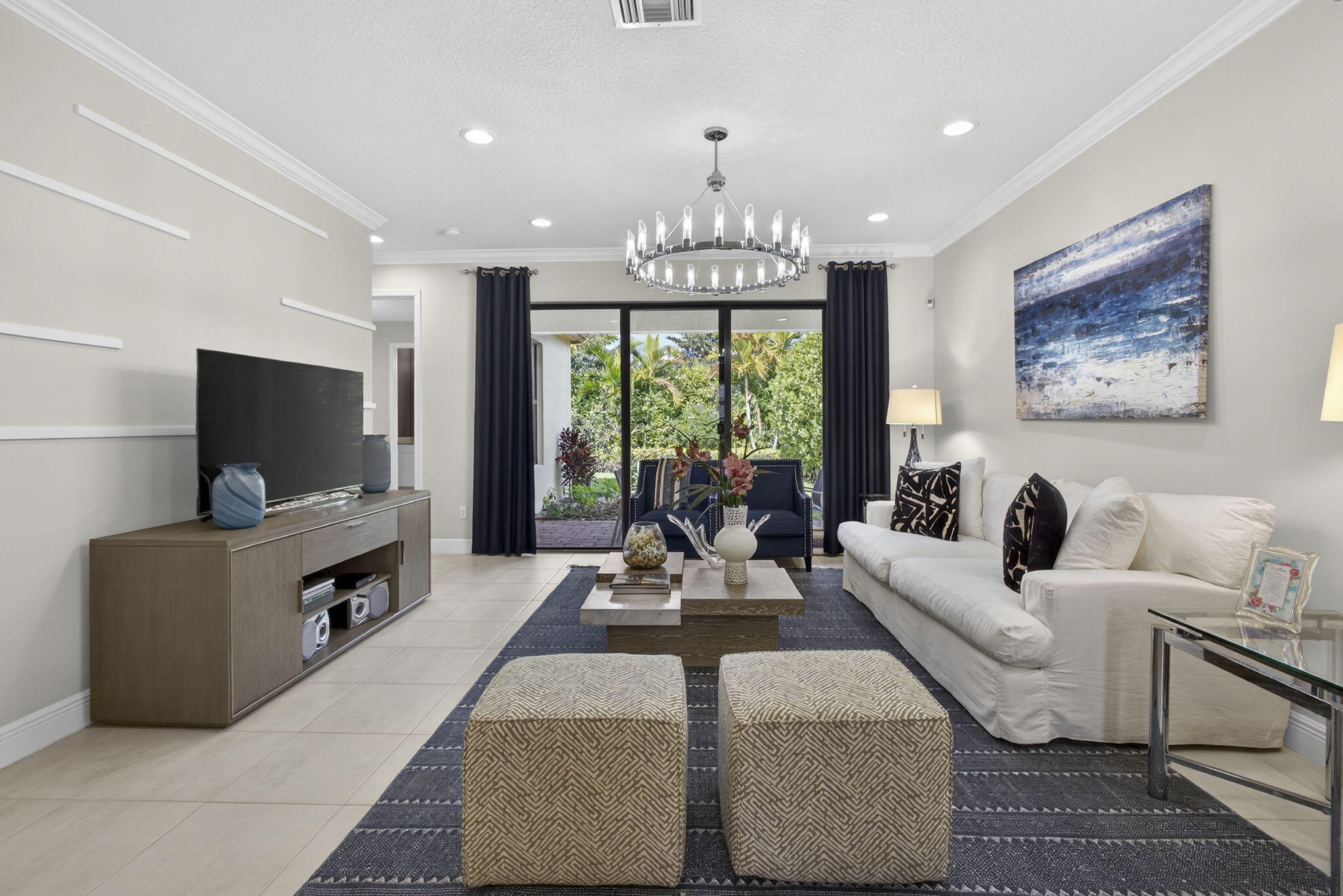 Move-in ready former model home in the gated Sky Cove community of Westlake offering designer upgrades, impact windows, and resort-style amenities without the wait of new construction. This beautifully upgraded 2-bedroom, 2-bath home delivers the ideal combination of low-maintenance living, modern finishes, and a prime location within one of Westlake's most sought-after gated communities.  Designed with comfort and functionality in mind, the home features 1,459 square feet of bright open-concept living space enhanced by 9-foot ceilings, abundant natural light, and durable tile flooring throughout.  The chef-inspired kitchen serves as the centerpiece of the home with quartz countertops, 42-inch cabinetry with crown molding, upgraded lighting, and a seamless flow into the dining and living areas—perfect for entertaining or everyday living.  The spacious split-bedroom floor plan provides privacy and flexibility for guests, a home office, or seasonal living. Impact windows offer added peace of mind and energy efficiency, while the professionally selected model-home finishes create a clean, elevated aesthetic throughout.  Located in Sky Cove at Westlake, residents enjoy access to resort-style amenities including pools, fitness areas, playgrounds, walking paths, and more, all within a rapidly growing community near shopping, dining, schools, and major roadways. This move-in ready Westlake home is an excellent opportunity for buyers searching for a gated community home with modern upgrades, low-maintenance living, and luxury-style amenities in Palm Beach County.