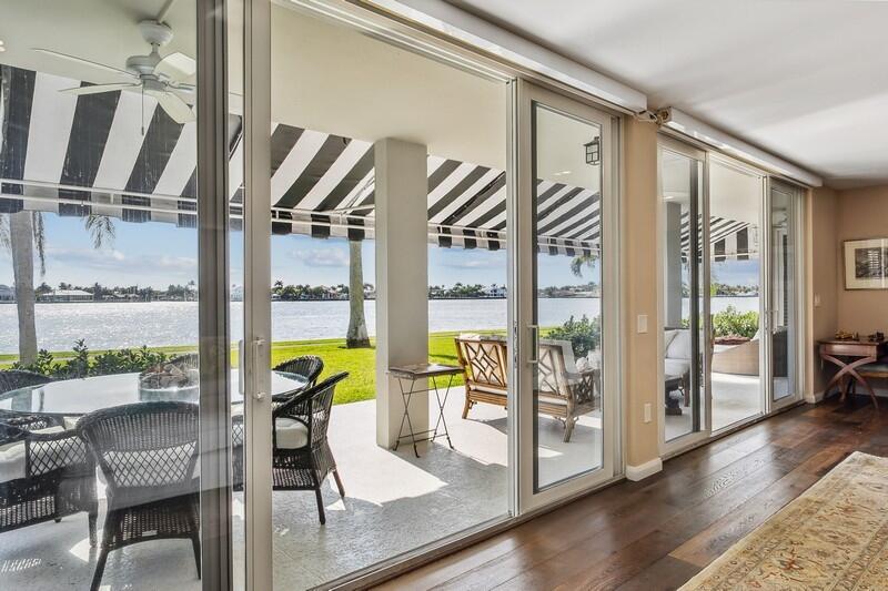 DIRECT WATERFRONT! A rare opportunity to own an exceptionally reimagined waterfront residence, this 4-bedroom, 4-bath ground-floor home at Chateau Cheverny captures the essence of refined coastal living. Meticulously renovated in 2020, this double-sized condominium offers an impressive 2,592 square feet of barrier-free elegance and the unmistakable feeling of a private home—all set against the backdrop of the majestic Intracoastal Waterway.

Step into this well-situated condo unit with French oak floors into a world of timeless sophistication. The grand living room unfolds toward an expansive lanai, where manicured lawns meet endless blue horizons.

Every detail has been curated for both beauty and comfort. Custom lighting, motorized blinds, and high ceilings enhance the sense of ... space and serenity.

The gourmet kitchen is a culinary dream, featuring a generous island, sleek Miele appliances, and a built-in grill topperfect for hosting unforgettable gatherings. A library/office with bespoke built-ins offers a tranquil retreat for reading or work, while the wet bar adds a touch of artful indulgence.

Each bedroom has been thoughtfully designed as a private sanctuary, complete with custom closet systems, Nest climate control, and sweeping water views that soothe the soul. The home is fully protected with impact windows, doors, and sliders, and constructed with concrete block and reinforced slabs for ultimate peace of mind.

Outdoors, the lanai invites relaxation with lighting, ceiling fans, and a graceful awning that frames the water's edge. A covered front patio and additional storage room complete this exceptional residence.

Nestled within an exclusive private island enclave, residents enjoy an atmosphere of effortless tranquility with two resort-style pools, open-air cabanas, a scenic walking trail, and a guardhouse. All thisjust minutes from world-class dining, boutique shopping, cultural attractions, and pristine beaches.

This is more than a home. It's a statement of elegance, serenity, and waterfront perfection.
