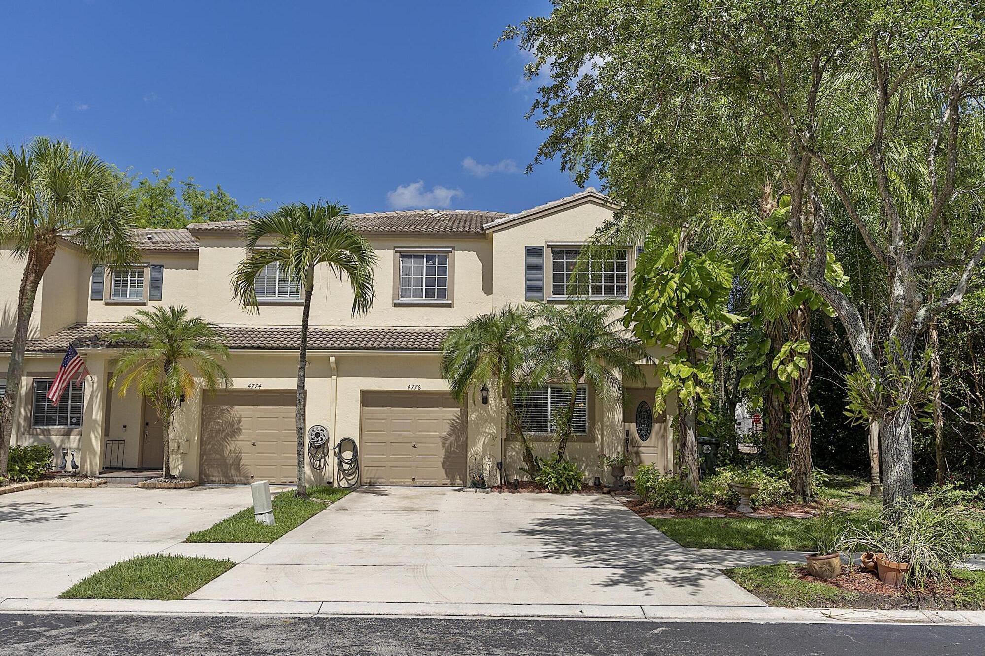 Spacious 4 bed, 2.5 bath corner unit in gated Lago Vista, ideally positioned on a cul-de-sac. The largest unit available in the community features a 1-car garage, driveway and plenty of parking for guests, newer water heater, tile flooring downstairs, hardwood flooring upstairs, and new light fixtures and high-hats throughout. The kitchen offers granite countertops, a new refrigerator and stove, pantry, and ample cabinet space. The primary suite includes a large walk-in closet and ensuite bath. Residents enjoy a community pool and grounds maintenance, all conveniently located near Winston Park and The Promenade at Coconut Creek. The home is also situated beside a nature preserve, providing added privacy with no future construction to be built directly next to you.