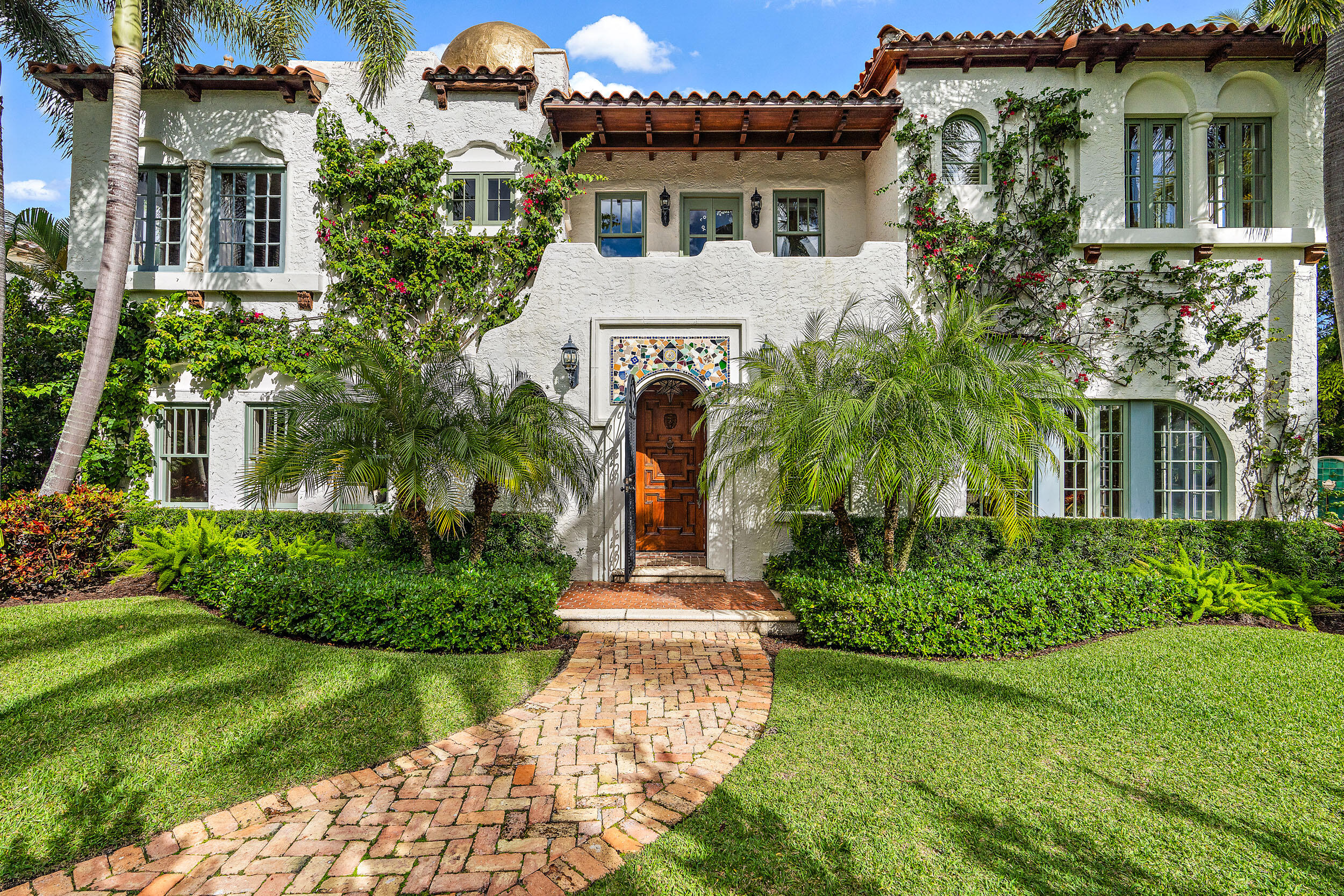 A very special EL Cid compound residence on attractive Valencia Road, this exceptional 1920's property has been completely renovated to the highest standards. This remarkable residence offers complete privacy with lushly landscaped & gated grounds. The main home has an elegant living room, dining room, family room, chef's kitchen with a Viking Stove, Sub-Zero refrigerator, & a wet bar. The kitchen opens to a beautiful heated pool & spa, outdoor dining area, pergola, & covered loggia. The covered loggia adjacent to the pool is the perfect place to relax & entertain. 

In the main house, there are 5 bedrooms; the first-floor bedroom could be a bedroom or den/office. The primary bedroom on the second level has an adjacent sitting room & a balcony with water views. There are also 3 bedrooms & an upstairs laundry room on the second floor. 

The gated entry opens to an elegant driveway leading to a two-car garage, second laundry room, which could also be an office or exercise room. Upstairs, the separate guest cottage has a living room,  kitchen, bedroom, & bath. There are many upgrades to the home & property, including: Sonos system, new A/C, electrical upgrading, a new water heater, & outdoor lighting.