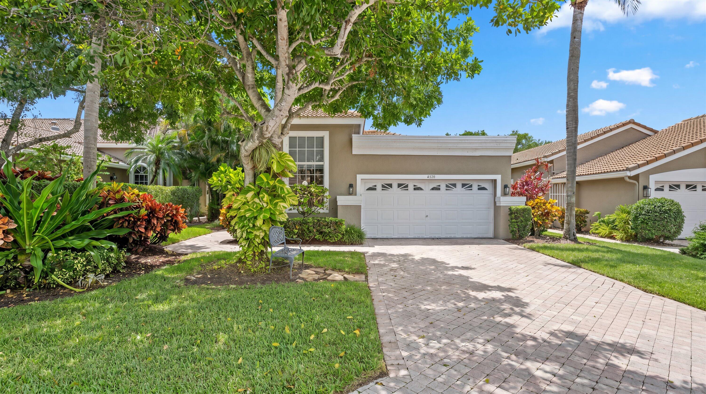 Fully renovated and move-in ready, this stunning villa offers sweeping golf course views in the prestigious Wycliffe Country Club. Featuring 2 bedrooms, 2 baths, and a 2-car garage, this beautifully updated home combines modern elegance with an open and spacious floor plan. Renovated throughout with porcelain tile flooring, the home showcases volume ceilings, abundant natural light, and bright eastern exposure that fills the living spaces. The updated kitchen is bright and inviting with white cabinetry, sleek finishes, and a skylight that enhances the natural light. The spacious primary suite offers generous closet space and a beautifully updated double vanity bath. Additional upgrades include a 2021 roof and impact sliders across the rear of the home, providing added peace of mind. This home is located within Wycliffe Golf & Country Club, a private country club community offering an exceptional lifestyle and an impressive array of amenities. Residents enjoy access to two championship 18-hole golf courses, a recently completed $18+ million clubhouse renovation, multiple on-site dining venues, a full-service spa, a state-of-the-art fitness center, an Olympic-size swimming pool with expansive sun deck, Har-Tru tennis courts, and new pickleball courts, along with a vibrant year-round social calendar. Wycliffe features fourteen distinct sub-communities, each offering its own architectural style and atmosphere, with a wide range of residences from thoughtfully designed townhomes to expansive estate homes. The master association provides comprehensive services including landscaping, security with manned gates, roving patrol and on-site paramedic services, as well as Comcast advanced fiber-optic cable, phone, and high-speed internet. Wycliffe is a mandatory membership country club, $140,000 to join.