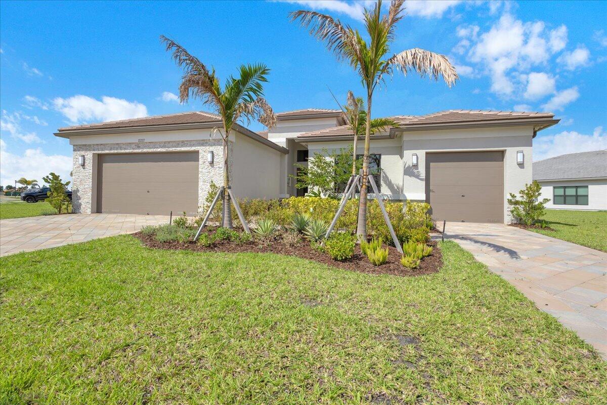 Beautifully upgraded 2025 Bellagio model in the highly sought-after 55+ community of Valencia Parc at Riverland. This spacious 3-bedroom, 3-bath home with a 3-car garage is situated on an oversized half-acre lakeview lot offering exceptional privacy and plenty of room for a pool. Thoughtfully designed with an open-concept layout, this home features a formal dining room, large family room, private office with custom built-in cabinetry, porcelain tile throughout the main living areas, impact windows, motorized window coverings, water filtration system, and a gourmet kitchen with quartz countertops and abundant space for entertaining. Enjoy indoor-outdoor living from the screened lanai and extended patio overlooking the peaceful water views.  Residents enjoy resort-style amenities including a clubhouse, fitness center, café/restaurants, pools, bocce ball, pickleball and tennis courts, and more. Conveniently located close to I-95, restaurants, shopping, medical facilities, and more.