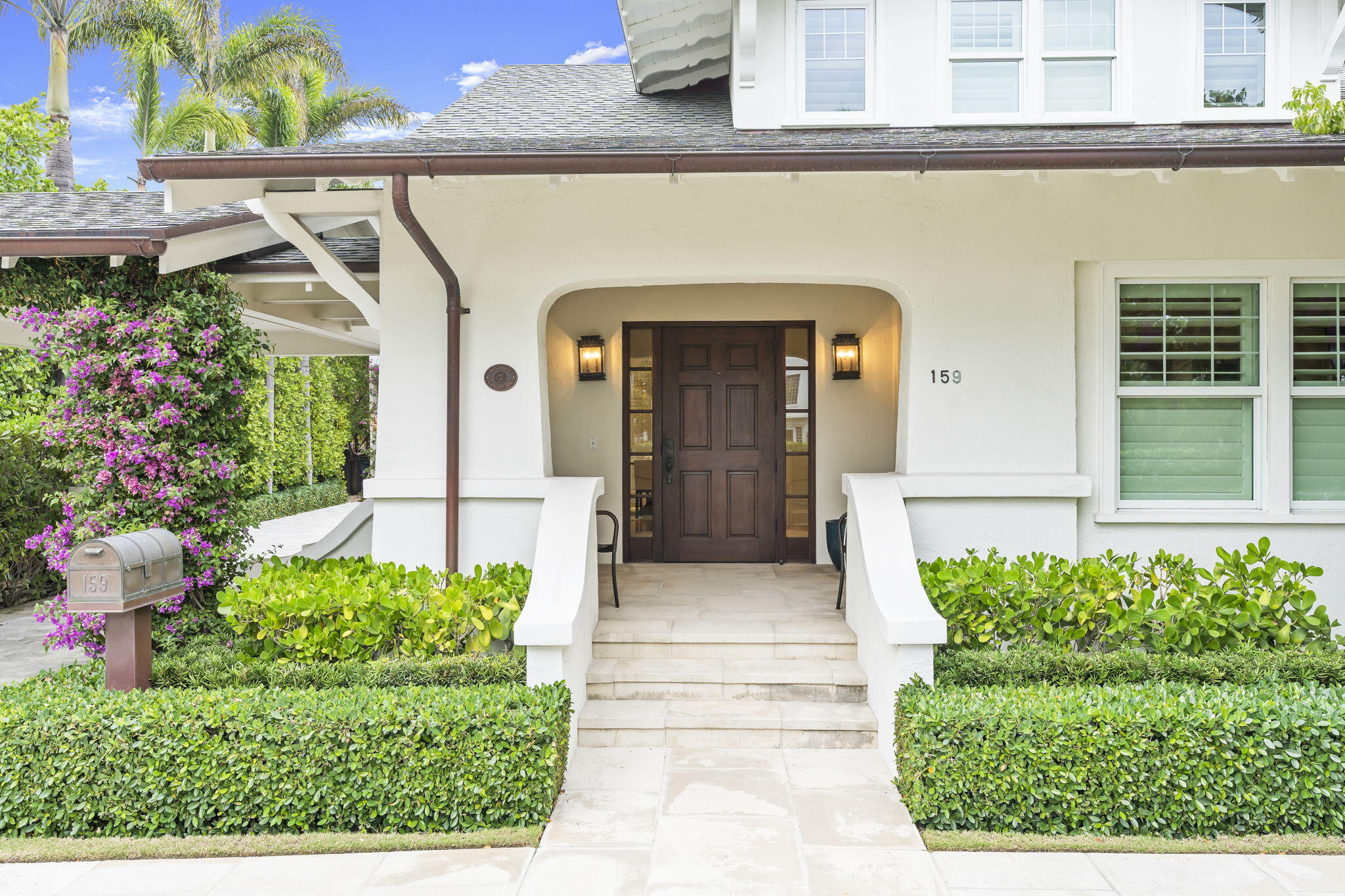 Move in ready ocean block home with master on the first floor opens to a private backyard with beautiful pool and gardens.  Bougainvillea blossoms adorn the porte-cochere leading to the charming entry porch. Inside, a welcoming foyer with a window seat and custom built-ins leads you to the formal living and dining room. The home is replete with pristine hardwood floors throughout, all new kitchen and bathrooms, full impact glass, and a first floor primary suite. Upstairs are two more guest bedrooms and a bonus room that would make a great home office or den. Attached to the main house by a breezeway is a 2 car garage with an exercise room, utility/laundry room, and a second story guest cottage with two bedrooms and bathrooms, and a living room. A heated pool is perfectly sited in the lushly landscaped gardens between the guest and main house. Landmarked in 2012 after extensive renovations this beautiful home was the winner of the Preservation Foundation's Polly Earl Award for its incredible attention to detail.