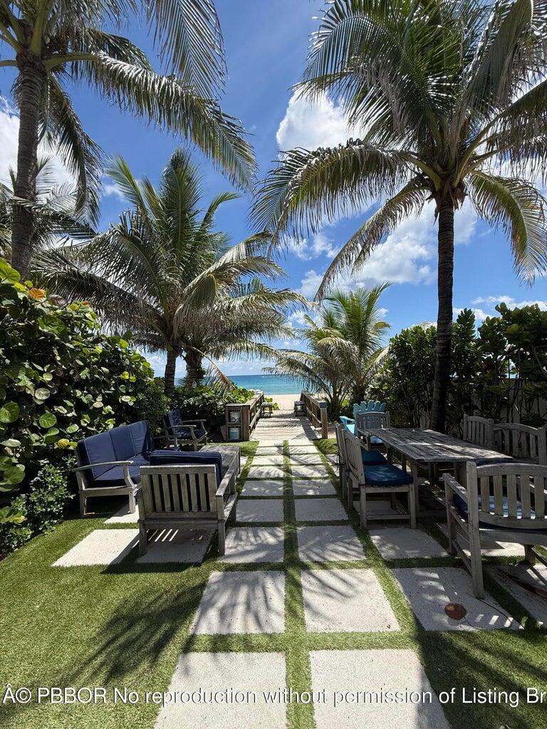 A beach lover's dream! Rare opportunity to own just one house from the ocean on coveted Merrain Road. This 4BR/3BA home offers 9-ft ceilings, a vaulted living room and an oversized 35' x 13' pool. A 2 car garage has been converted into bonus space and is currently set-up as extra bedroom but could be a gym, office or converted back. Enjoy sunrise strolls, afternoon swims, and the best surf in town—all steps from your front door. Merrain Road maintains a lounging area and shower at the ocean to complete your beach experience. The Lake Trail is nearby for biking and sunset walks. Reimagine this North End gem into your own Palm Beach paradise!