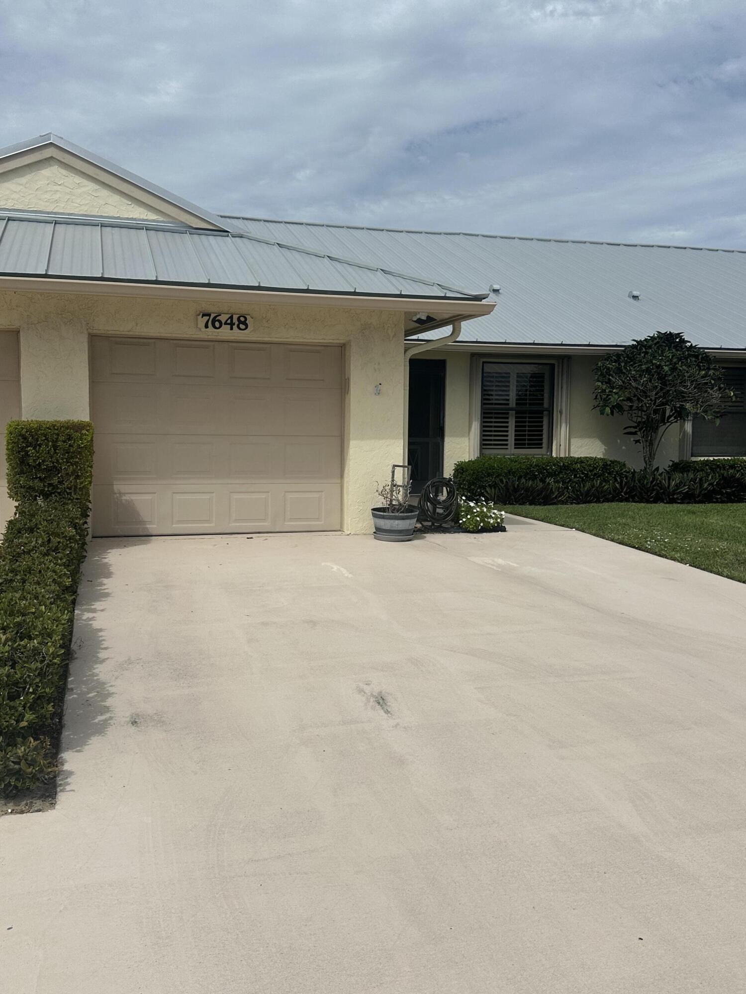 Charming coastal villa in the desirable Sugar Sands community! This beautifully maintained 2-bedroom, 2-bath home offers comfortable Florida living with a 1-car garage and spacious open layout. Vaulted ceilings and natural light create an inviting atmosphere, while the updated kitchen and modernized bathrooms add style and convenience.   Enjoy a covered patio perfect for relaxing or entertaining, plus plenty of storage throughout. Located in a sought-after 55+ community, residents have access to resort-style amenities including a heated pool, hot tub, clubhouse and more. Just minutes to beaches, shopping, dining, and everything the Hobe Sound coastal lifestyle has to offer.  Leasing during the first year of ownership is prohibited.