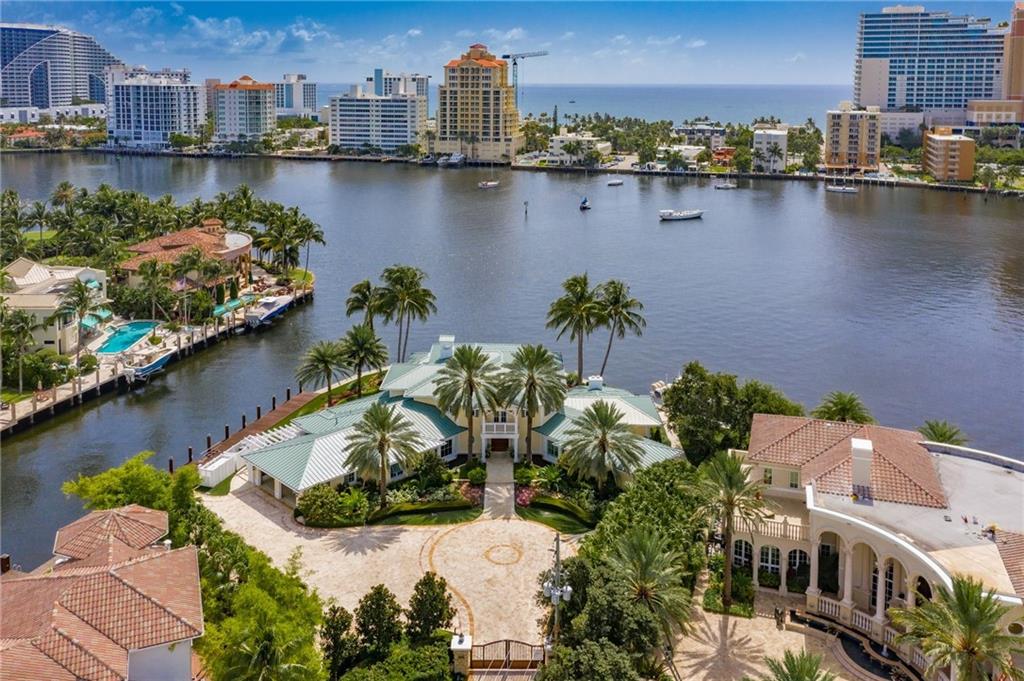 No expense was spared in this stunning British West Indies home! This point lot has mega yacht dockage w/ 3 phase power & breathtaking Intracoastal views in a no-wake zone. Gated property w/ all the bells and whistles such as high-end finishes throughout, gourmet kitchen w/ commercial exhaust system & top-of-the-line appliances including 12 burner gas stove, 2 master suites, 2 offices, walnut wood & marble floors, elevator, 20,000lb boat lift, full house generator, Crestron smart home system & security system. Resort-style backyard w/ saltwater pool, outdoor kitchen, irrigated Astro Turf & cabana bath. Perfect for entertaining all year w/ amazing views & a constant breeze. Located in the security patrolled Seven Isles neighborhood close to Las Olas shops, fine dining, the beach & airport. No expense was spared in this stunning British West Indies home! This point lot has mega yacht dockage w/ 3 phase power & breathtaking Intracoastal views in a no wake zone. Gated property w/ all the bells and whistles such as high-end finishes throughout, gourmet kitchen w/ commercial exhaust system & top-of-the-line appliances including 12 burner gas stove, 2 master suites (one up & one down), 2 offices, elevator, 20,000lb boat lift, full house generator, Crestron smart home system & security system. Walnut wood and marble floors make this house feel warm & comfortable. Resort style backyard w/ heated salt water pool, outdoor kitchen, irrigated Astro Turf & cabana bath. Perfect for entertaining all year w/ amazing views & a constant breeze. Located in the security patrolled Seven Isles neighborhood close to Las Olas shops, fine dining, the beach & airport.