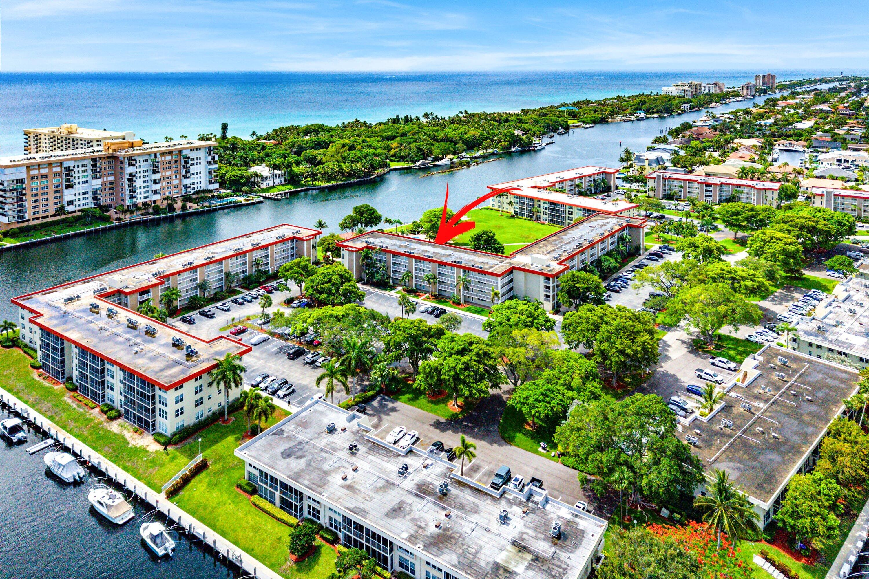 Rarely available top-floor residence in the highly desirable Palm Aire community of Lighthouse Point. This spacious and light-filled 2-bedroom, 2-bath condo offers beautiful views of the Intracoastal Waterway, community pool, and lush green space from the large screened-in balcony—an ideal spot to relax and enjoy the coastal breeze. The interior features tile flooring throughout the main living areas, impact windows and doors, and an updated kitchen with granite countertops, stainless steel appliances, and ample cabinet space. The open living and dining areas are bright and inviting, creating a comfortable setting for both everyday living and entertaining. The primary suite is a true retreat, featuring warm wood flooring with abundant natural light, an updated en-suite  bathroom, a walk-in closet, and an additional oversized closet for exceptional storage. The spacious second bedroom is bright and welcoming and includes its own en-suite bath, providing privacy and convenience for guests. Additional highlights include a rare in-unit washer and dryer and additional storage. alm Aire is one of Lighthouse Point's most sought-after waterfront communities, offering a resort-style atmosphere in an unbeatable location. Just minutes from beaches, marinas, golf, shopping, and dining, this property presents an exceptional opportunity to enjoy the best of South Florida living, whether as a full-time residence or seasonal getaway.