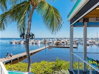 SEASIDE COASTAL CONDO... LIGHT and BRIGHT! 2 / 2 with VIEWS OVERLOOKING the ST. LUCIE RIVER FROM YOUR BALCONY and MASTER SUITE! GREAT FLOOR PLAN HAS NEUTRAL CABINETRY & GRANITE, MARBLE FLOORS... FULL SIZE WASHER & DRYER IN UNIT... STATE of the ART FITNESS CENTER OVERLOOKING WIDE RIVER - 2 POOLS - POOLSIDE GRILL, PRIVATE YACHT CLUB RESTAURANT + TIDE HOUSE ...PARKING UNDER BLDG... WALK to HISTORIC DOWNTOWN NAMED "HAPPIEST SEASIDE TOWN" by COASTAL LIVING! ONE TIME $10,000. YACHT CLUB NON-EQUITY MEMBERSHIP. INVESTORS... 30 day RENTALS ALLOWED / HOA APPROVAL REQUIRED. DOCKAGE AVAILABLE in this FULL SERVICE MARINA CALL FOR RATES...JUST MINUTES to INLET and BEAUTIFUL BEACHES...PERFECT MOVE IN CONDITION....CALL for DETAILS!