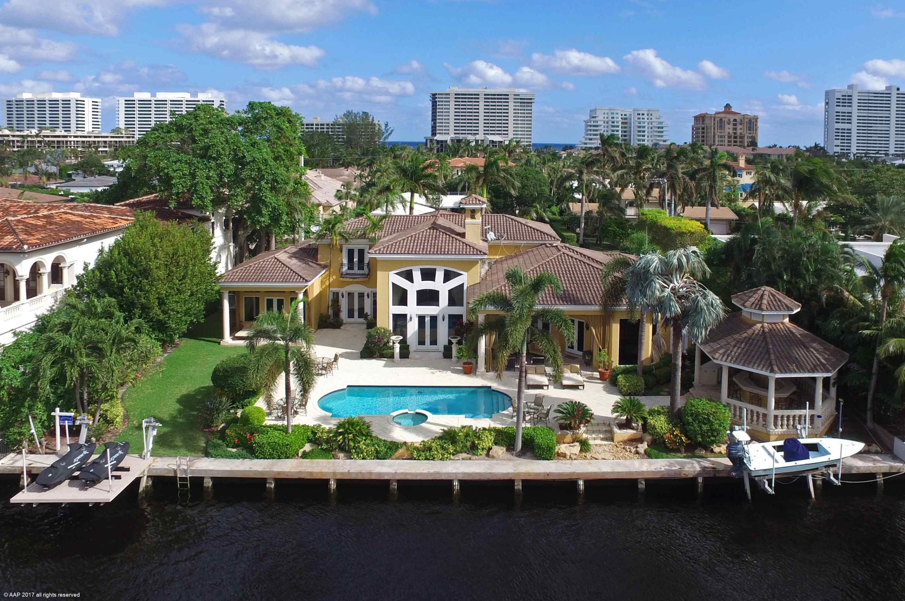 This fabulous Gated Estate is situated on almost half an acre and 135 ft of prime Direct Intracoastal in the prestigious Estates Section. Absolutely fabulous details, high ceilings, gorgeous kitchen and baths, Large first floor master, french doors, great lawns, covered loggia and Gazebo w/ bar and bbq & For the boater a boat lift and jet ski lift and walk just blocks to the beach!