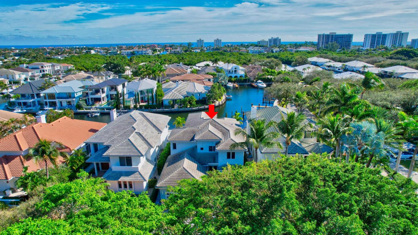 Nested in the exclusive Boca Marina Yacht Club, this east exposure waterfront estate offers long water views and 57 feet of private dockage on the canal with direct ocean access. This modern designer decorated residence features five generously sized bedroom suites including the master and office suites on the first floor, high ceilings, chef's kitchen with Thermador/Miele appliances and wet bar entertainment area. Alfresco outdoor kitchen, heated saltwater pool and cabana bath make this property perfect for Florida living and work. Equipped with manned gate, interior and exterior security system and cameras, hurricane windows and doors, Control 4 smart home system. Perfect location with access to best schools restaurants, entertainment, and country clubs.