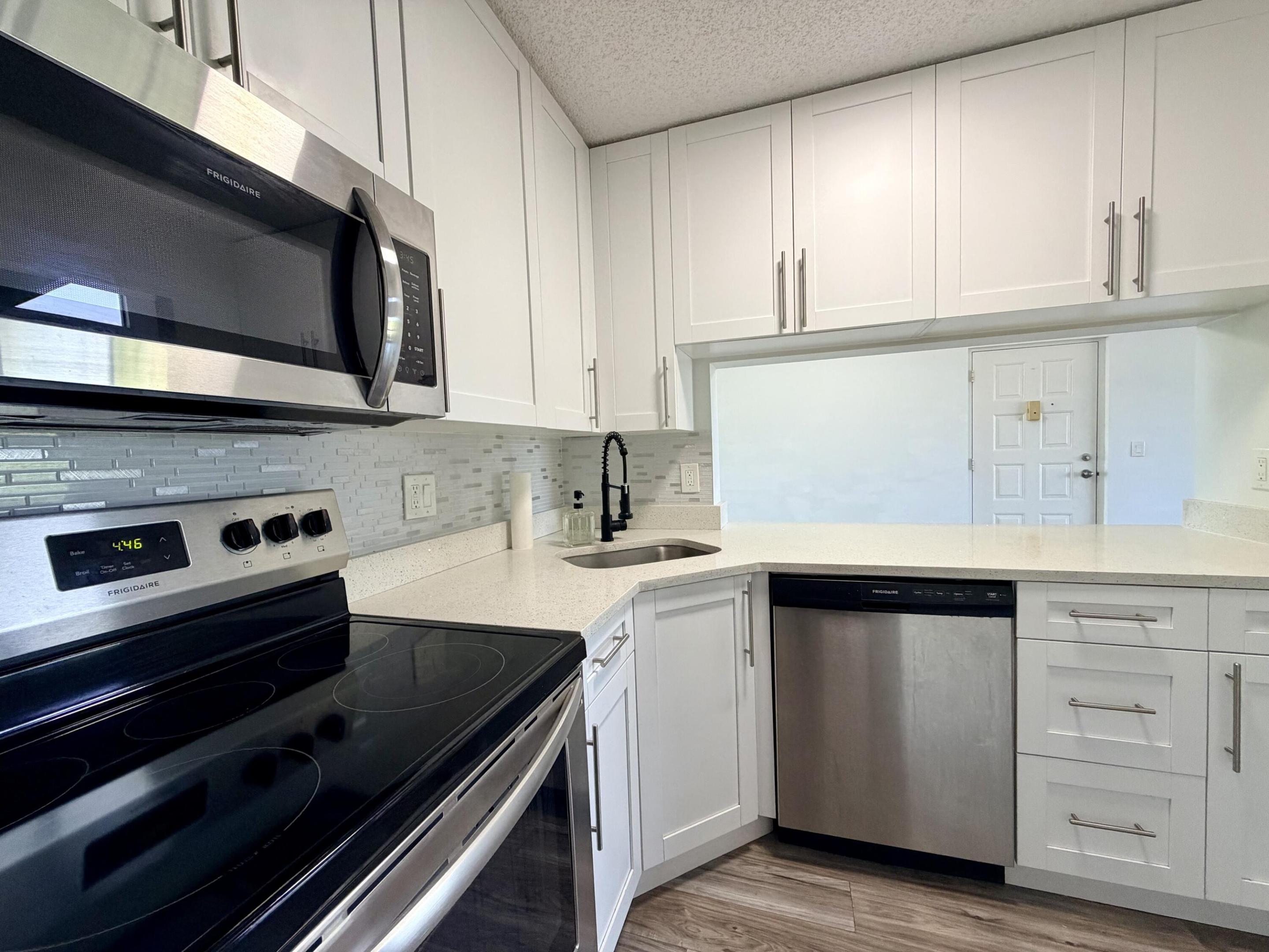 Move into this newly renovated property, with an updated kitchen and stainless steel appliances. New wood flooring, freshly painted, and renovated bathrooms. On-site laundry. No Age Restrictions! All of this with an excellent location: Just 3 Minutes from Okeeheelee Park, 2 Minutes from Publix, Walmart, Gyms, gas stations, 7 minutes from Wellington Mall, and more. Easy to commute to I95 and FL. Turnpike. Community features: Lake with walking trails, Club House with Pool and games, common areas with grills and more. Just bring your toothbrush!! Don't miss this one!
