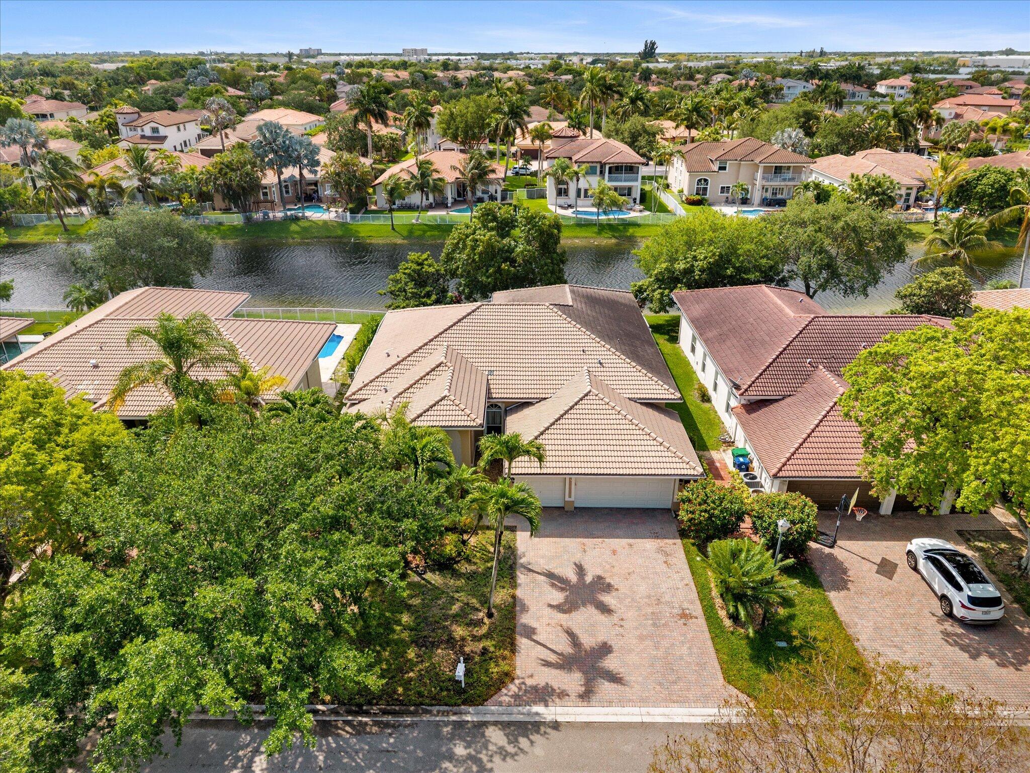 ABSOLUTELY GORGEOUS WATERFRONT HOME | TOP RATED SCHOOLS | LOW HOA | ROOM FOR POOL | NEWER APPLIANCES | Bright Open Floor Plan | Triple Split Layout | LED High Hat Lighting | Tile Flooring Throughout | Vaulted Ceilings & Crown Molding | Eat-In Kitchen | Granite Counters, 42" Wood Cabinetry, Stainless Steel Appliances, Barstool Seating, Pantry & Breakfast Area | Primary Suite w/ Patio Sliders, Walk-In Closets & Ensuite Bath w/ Jacuzzi Tub | Covered & Screened Patio | Fully Fenced Yard | 3 Car Garage | Prime Coral Springs Location | Minutes to Recreational Parks, Sawgrass Expressway, Fine Dining & Shopping | HOA Includes Lawn Care & Sprinkler Maintenance | Immediate Rental Opportunity | 5th Bed Used As An Office | AC 2019 & 2014 | WH 2024 | PRESENT ALL OFFERS!