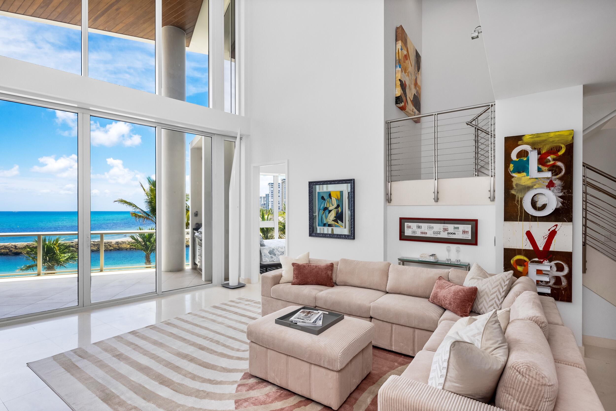 An exceptional value in one of Boca Raton's rarest oceanfront residences. Set within the prestigious One Thousand Ocean, Beach Villa 103 is a true generational offering—an irreplaceable, two-level condominium whose rarity and distinction place it in a class of its own, unmatched both within the building and along the entirety of Boca Raton's oceanfront. As you step inside, you're greeted by dramatic ceiling heights and an infusion of natural light that flows effortlessly throughout the home, accentuating its sleek, modern aesthetic and amplifying the spacious ambiance.  Thoughtfully designed with a seamless, open-concept layout and desirable southeast oceanfront orientation, this singular property captures expansive, tranquil views of the Boca Raton inlet and the Atlantic Ocean, offering a daily display of natural beauty that defines elevated coastal living. Spanning two levels, the home features four spacious bedrooms, complemented by six full baths and a powder room, each appointed with sophisticated finishes, as well as a full den which can be easily converted to a 5th bedroom. A unique private in-residence elevator serves both levels of the home and offers direct access to the garage, ensuring unparalleled privacy and effortless convenience. Four bedrooms are oceanfront private retreats, filled with light and designed to maximize comfort while showcasing the surrounding scenery. At the core of the home is the designer kitchen, where high-performance appliances, custom cabinetry, and streamlined details converge. From here, the kitchen flows seamlessly into the dining and family areas, creating a harmonious setting equally suited for sophisticated entertaining or the effortless enjoyment of everyday life.  Expansive oceanfront terraces, one on each floor, provide curated outdoor living spaces, including a private plunge pool and a dedicated dining area, perfect for unwinding or hosting in an al fresco setting.  A private cabana is available for purchase separately. Designed by world-renowned architects Garcia Stromberg, One Thousand Ocean stands as a symbol of timeless luxury and architectural excellence. Residents benefit from exclusive amenities such as 24-hour security and valet, along with the convenience of a private two-car garage and personal storage.