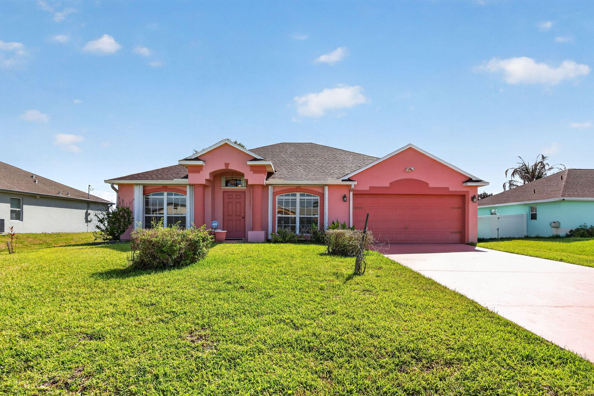 Rare find in the heart of Port St. Lucie! This solid home features a brand-new roof (2026), providing immediate peace of mind and insurance savings. The interior boasts a large open kitchen—perfect for those who love extra counter space—and two separate sitting rooms, offering the versatility of a dedicated home office or formal living area.  Best of all? NO HOA and NO CDD bond fees, giving you total freedom and lower monthly carrying costs. Situated in a prime central location near shopping and dining, this is an ideal opportunity for anyone looking for a low-maintenance property without the restrictive rules. 1885 SW Morelia Lane is ready for its next owner. schedule your showing today
