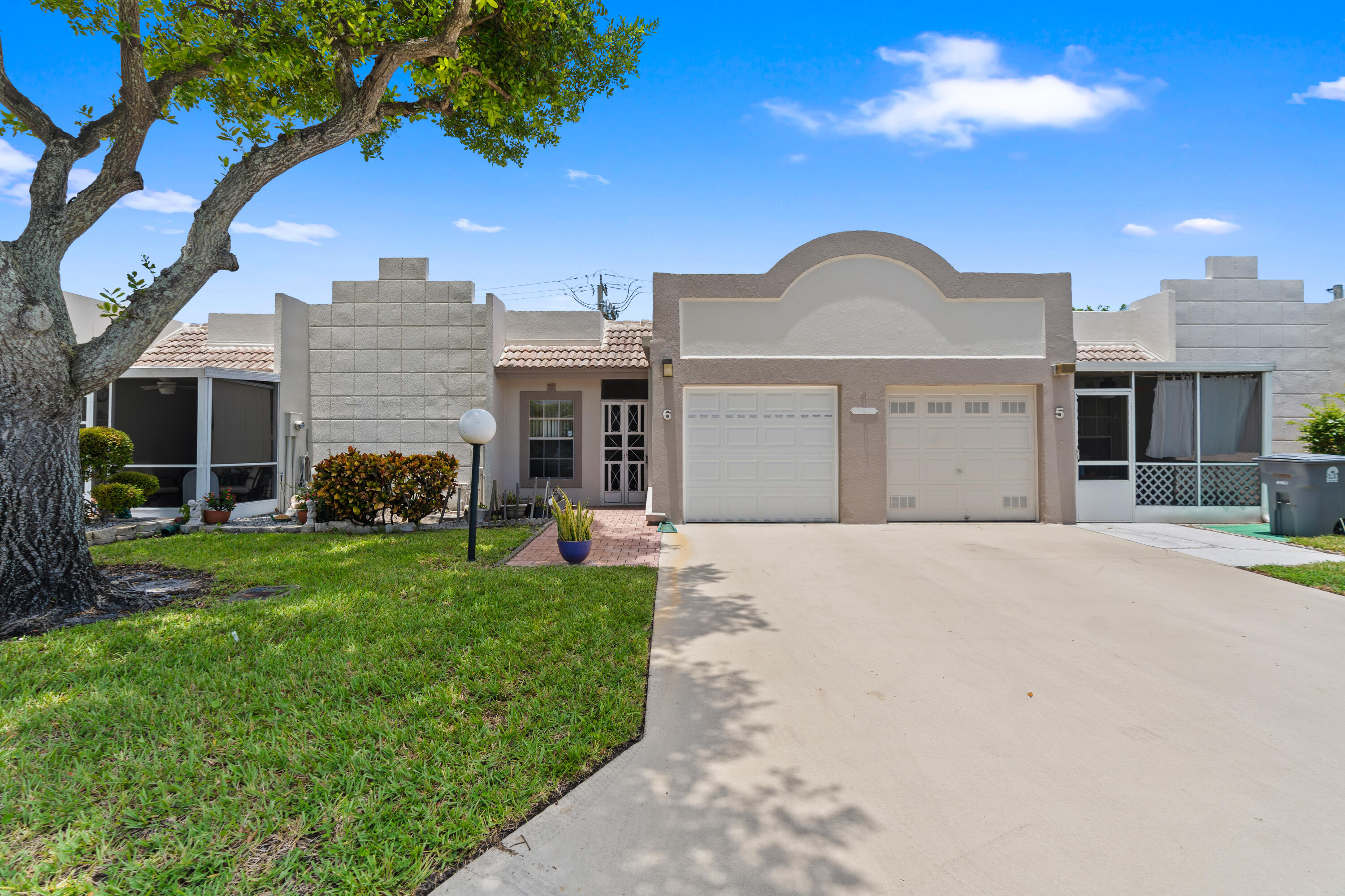 Welcome to easy Florida living in Town Villas, a pet-friendly community offering this charming 2-bedroom, 2-bath villa with a 1-car garage! This home features a comfortable and functional layout with an updated open kitchen, a newly installed A/C unit, new pavers, and both a screened front entrance and screened rear patio. Move right in and enjoy the home as it is, or add your own personal touches to make it your own. The low monthly association fee offers exceptional value and includes cable, internet, common area maintenance, roof maintenance, and access to an impressive selection of community amenities. Residents enjoy a heated pool and spa, pickleball and tennis courts, fitness center, bocce ball, billiards, clubhouse, and on-site management, creating an active and welcoming environment. Ideally located near shopping, dining, hospitals, downtown attractions, major highways, two international airports, and South Florida's beautiful beaches, this villa offers the perfect combination of comfort, convenience, and the Florida​​‌​​​​‌​‌​​​‌‌​​​‌‌‌​​‌​​‌‌​​​​ lifestyle.