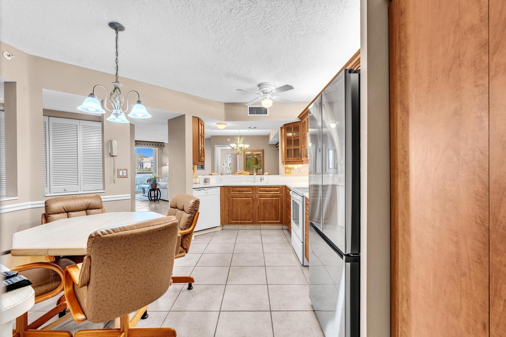 Rare Find** The larger Seagrape Model* Welcome to this beautifully updated, move-in-ready, lovely home located in the prestigious Weldon community of Kings Point in Tamarac! As you step onto your large, private front patio, you feel a warm invitation into your home, 2 bedrooms & 2 baths. It has a formal dining room & gorgeous, wide-open water views from both bedrooms, living room, the kitchen, & the dining room. Fabulous, featuring a large, open, magnficent upgraded kitchen with granite countertops & a spacious breakfast area. New stainless fridge. Beautiful Tile flooring throughout the living area, newer carpet in the bedrooms. Both bathrooms are upgraded tastefully. Impact windows and sliding doors leading to your screened patio, plus acrylic sliding door to prevent rain from coming in.  Ample open layout & a beautiful split floor plan offer a comfortable living experience. The master suite features spacious walk-in closets, light & bright. 24/7 Security at the gate. Enjoy the amenities of the Kings Point Community, including a state-of-the-art performing arts theater, a courtesy Shuttle, indoor and outdoor pools, a Gym, a Clubhouse, a pickleball court, Tennis Courts, shuffleboard, and a billiards room. There are also Arts and craft classes, a card room, shows, and much more.