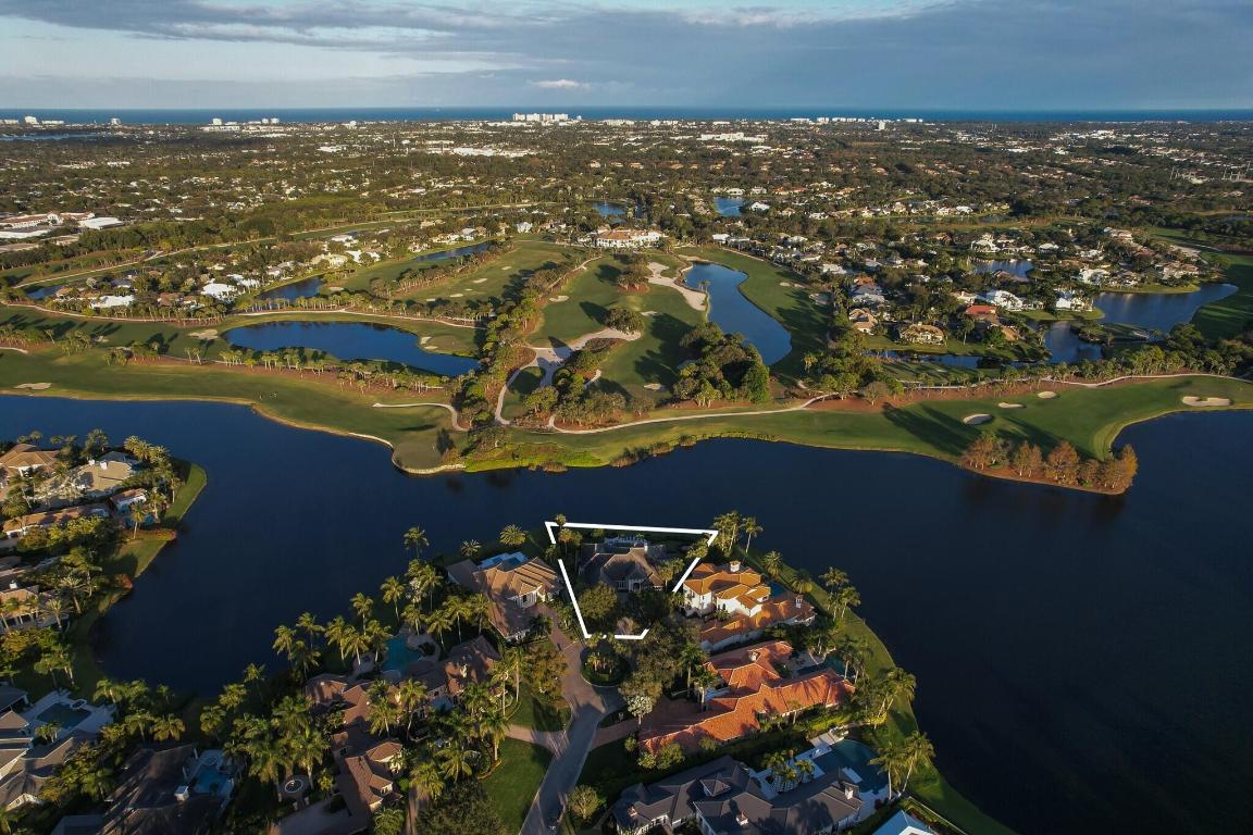 Welcome to one of the most coveted addresses in The Loxahatchee Club. Perfectly positioned at the end of a quiet cul-de-sac, this exceptional point lot offers some of the most spectacular golf and water views in the entire community. With sweeping vistas in every direction, this property represents a truly rare opportunity. The existing residence is move-in ready, offering comfortable living from day one — yet it also serves as the perfect canvas for a major renovation or an extraordinary new build. Premier lots of this caliber are few and far between. Beyond the property, residents of The Loxahatchee Club enjoy world-class amenities including 18 holes of championship golf on a Jack Nicklaus Signature course with a renowned caddie program, a newly renovated clubhouse designed in classic British West Indies style, a state-of-the-art fitness center, spa, tennis courts, and exceptional dining. This is timeless, understated elegance at its best   and an opportunity to own one of the finest locations within Jupiter's best-kept secret.