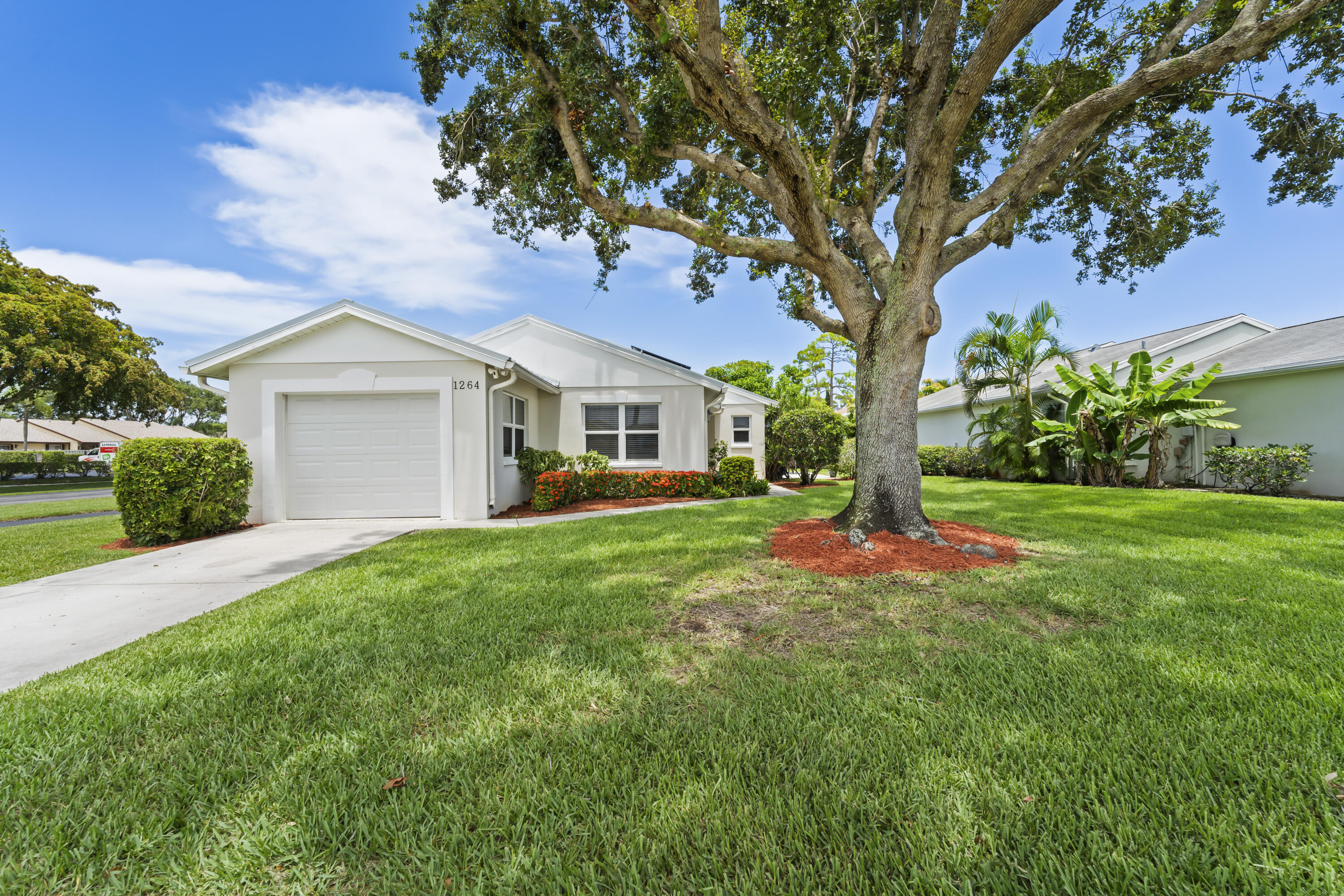 Beautifully updated 2-bedroom, 2-bath single-family home in West Palm Beach offering low-maintenance living with modern upgrades throughout. Features include a 3-year-old metal roof, paid-off solar panels, impact windows, 3-ton A/C less than 3 years old, tankless water heater, updated kitchen with newer appliances, vinyl flooring, and an open-concept layout. The converted laundry room provides a functional office space for added flexibility. The one-car garage includes a charging station for added convenience. Enjoy avocado and mango trees out back, less yard work, and more easy Florida living!