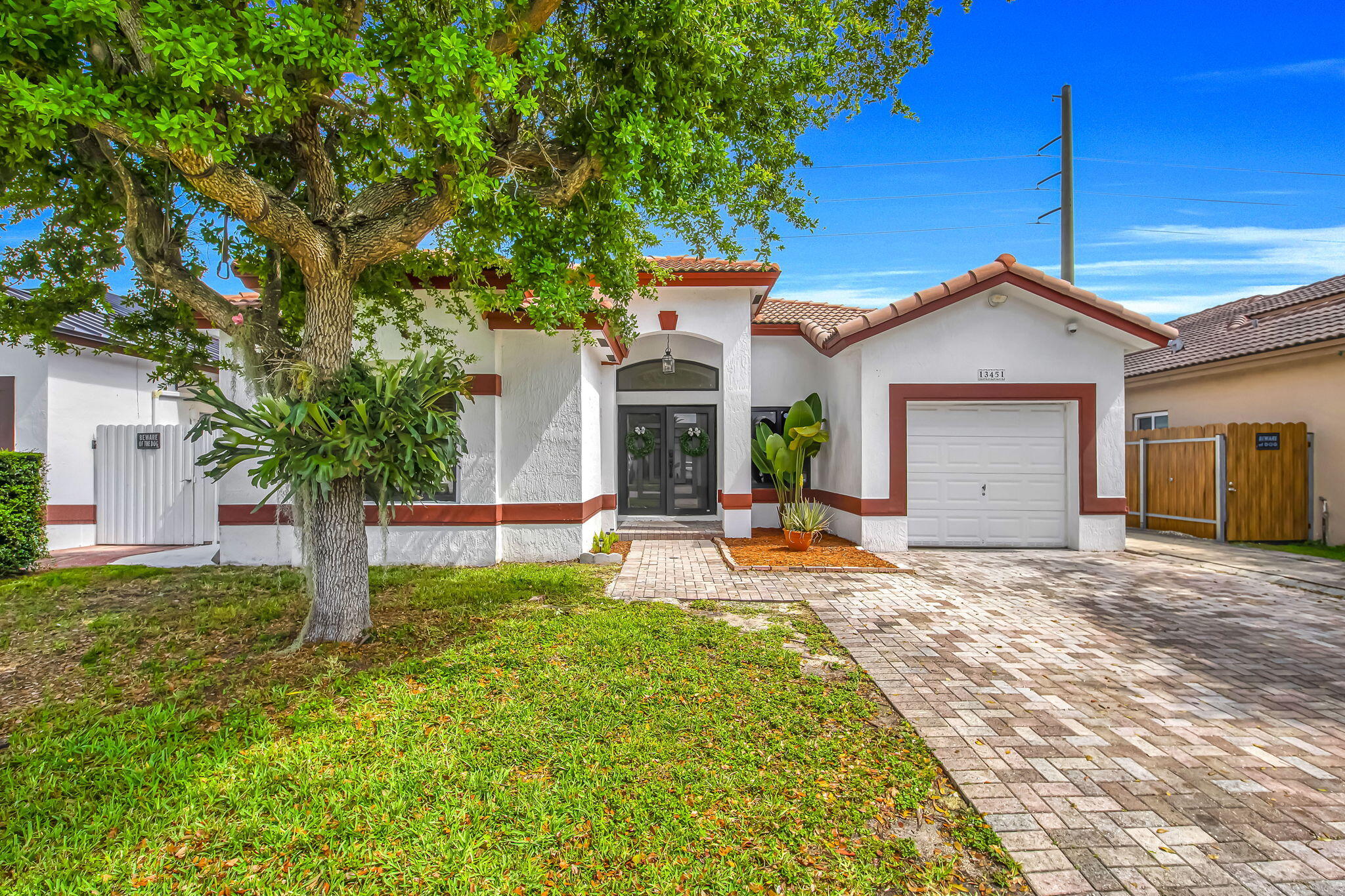 This beautifully maintained residence in Homestead features 3 bedrooms  2 bathrooms + den. Built in 2007, this home features high ceilings with lots of natural light, a modern open kitchen, stainless-steel appliances, vinyl flooring, impact windows and doors throughout. Outside features a beautiful covered patio; perfect for entertaining, fully fenced for privacy and fruit trees throughout. Centrally located with convenient access to the Turnpike, this home offers comfort, functionality, and ease of living in a well-established neighborhood. NO HOA!