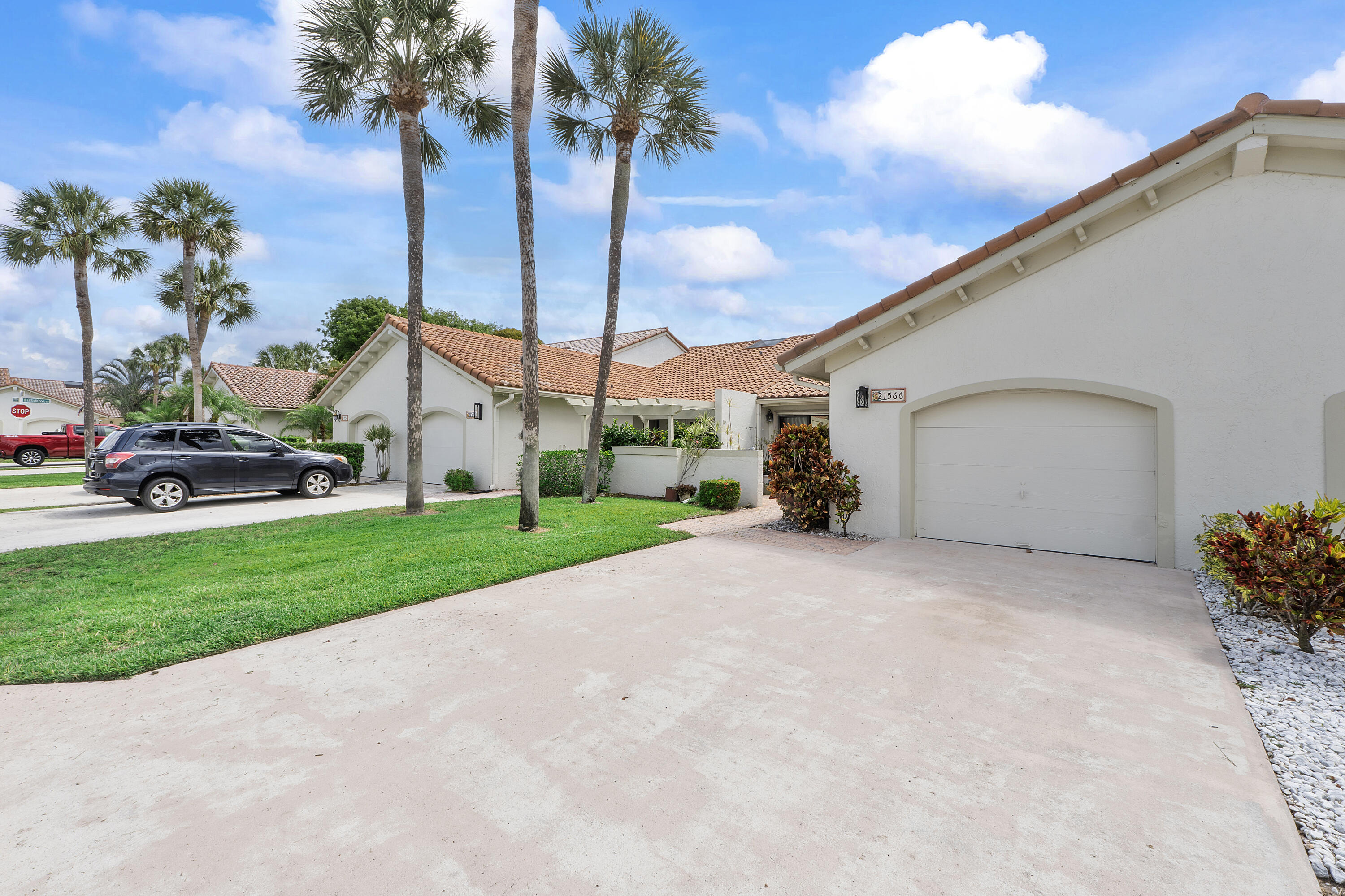Come home to your pretty, tranquil villa community. This home has attached garage and private front porch.  Screened back porch with ceiling fan looks into your private fenced yard.  Eat-in kitchen. Living room with vaulted ceilings.  Split bedrooms gives you privacy.  Primary bedroom has a walk in closet plus another double wide closet, and sliders onto an separate porch. Wall to wall and floor to ceiling sliding doors in living room lead to the screened lanai with ceiling fan for extra comfort on summer days. Eat in kitchen also has a full wall of sliding doors for amazing sunlight. Accordian storm shutters on windows. This community has a community pool and other amenities to round out your lifestyle.