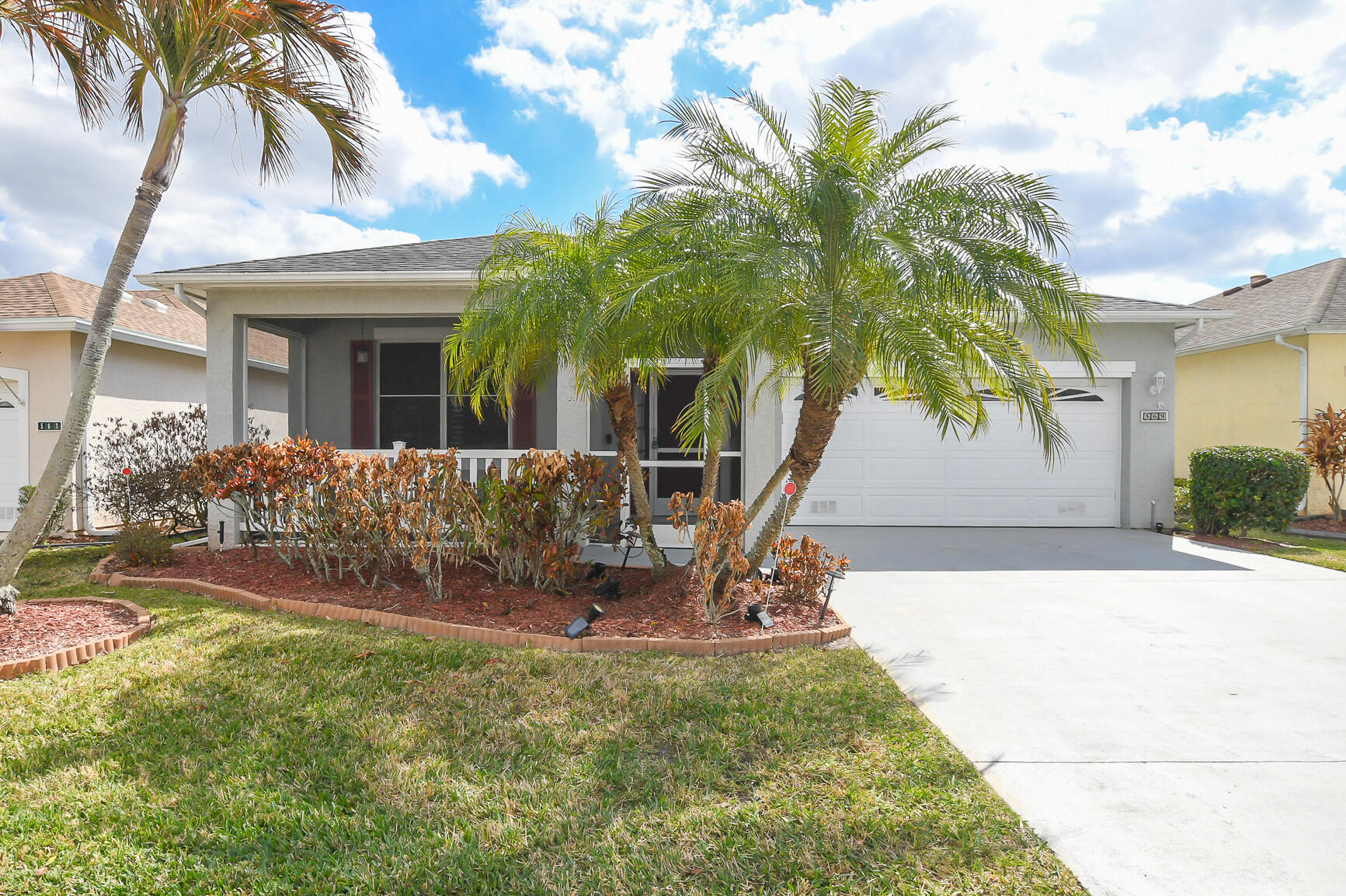 Beautiful Home in Isle Of San Marino at Kings Isle (55+ community in St Lucie West). Features CBS Construction, fabulous front porch, 2 BR's, 2 BA's, 2 CG with foyer entrance offers tile & laminate flooring, volume ceilings & spacious living/dining area. Updated Kitchen includes plenty of cabinets, Stainless steel appliances, breakfast bar & pantry. Split Floor plan, updated Master bathroom, lighting, fans & attention to details. Enjoy the Screen enclosed Lanai with garden View & vinyl window plus additional screen enclosed lanai. HOA Fee's include manned gated security, lawn care, cable, internet, Recreation center & common areas. Close to shopping, doctors, restaurants, hospital & even home of the NY Mets Spring Training.