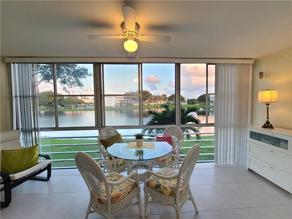 Extremely well maintained updated 1 bedroom, 1.5 bathrooms 2nd floor condo. Updated kitchen wood cabinets. Lots of storage space.  Tile flooring. New Water heater 2022. FULLY FURNISHED TURNED-KEY. Updated bathrooms w/ tub & shower. Prefer sun exposure to enjoy a relaxing water view from your enclosed 8 foot patio. Great location close to the clubhouse. Well maintained building. Offers a BBQ and sitting area by the water. Reserve funds. Offers a nice eating, BBQ & sitting area by the water. Welcome to Century Village active 55+ community. Resort Style living 24/7 gated. Bus service, Clubhouse. New Mini Golf. Minutes to the Beach & shopping & Restaurants. Can rent after 2 years, min 90 days max 6 months 1 rental per year.