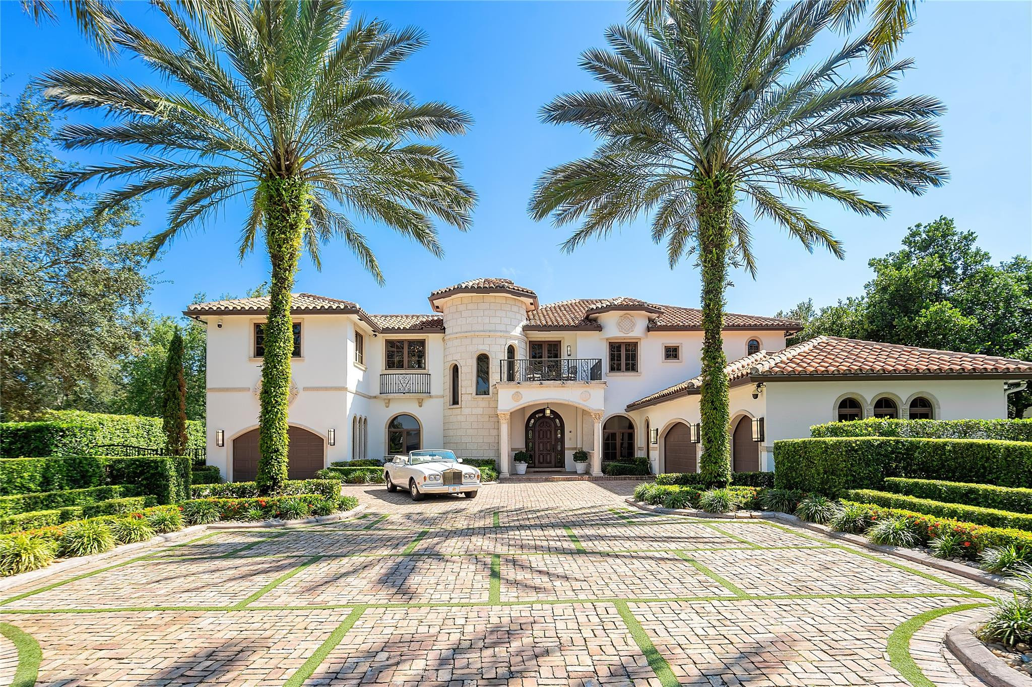The crown jewel, highlighting the luxurious and leisurely lifestyle, making it the best choice for those seeking an extravagant living experience in Stonebrook Estates! This property is an opulent Mediterranean estate, that has been completely customized featuring architectural elements including travertine columns, clay tiled roofs, and elegant detailing. Relax on the primary terrace overlook immaculate gardens. The fireplace adds to the overall ambiance, with courtyard views. The custom chef's kitchen, equipped with high-end appliances for gourmet cooking. The home theatre with surround sound, offers an excellent entertainment option for watching movies. Enjoy a pool day in the resort-style courtyards. The estate includes its own 4-hole golf course, perfect for golf enthusiasts. This ultra-lux Mediterranean estate is completely customized, offering the ultimate amenities include labyrinth Versailles like gardens, resort courtyard pool w/fountains, covered 20-person spa, summer kitchen and dining, putting green, two pergolas, fire pit, marble water fountain, artistic brick driveway fitting 25+ cars, chefs kitchen & butler pantry (all WOLF & Subzero appliances), gymnasium, wine cellar w/ humidor, cinema, executive office, library, card room, recording studio, 2 laundry rooms, guest house. 90KW generator (1,000-gallon tank). *FURNITURE PACKAGE AVAILABLE FOR TURN KEY LIVING*
