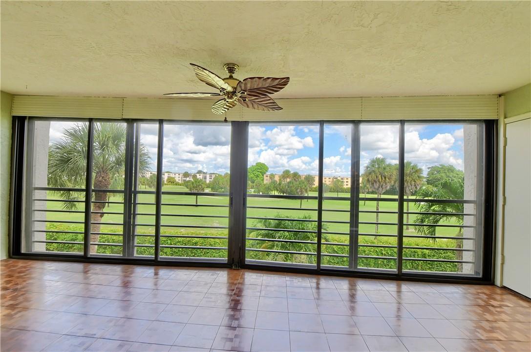 Location, Size and View are the most important features of this 2 bedroom, 2 bathroom condo.  Fabulous location near highly rated hospitals.  Gorgous golf course views.  Very large 1500 square foot unit with the feel of a home. Beautifully renovated kitchen.  Washer and Dryer in the unit.  Lots of storage.  Outside storage cage.   Plantation shutters in the front room and kitchen.  AC 7 years.  Water Heater 2021.  Panel Box 2 years.  Floor includes ceramic tile, teak and carpet. Master bedoom carperting Less than 1 year.  Toilets are 2 years.  Vanity in the master bedroom 2 years.  Convenient covered parking spot.  Amenities include Clubhouse, 2 Pools and Tennis Courts.  The balcony includes sliders, extending the unit significantly! The balcony includes gliders, extending the unit significantly!  The balcony is fully enclosed, adding another large room to the c ondo.