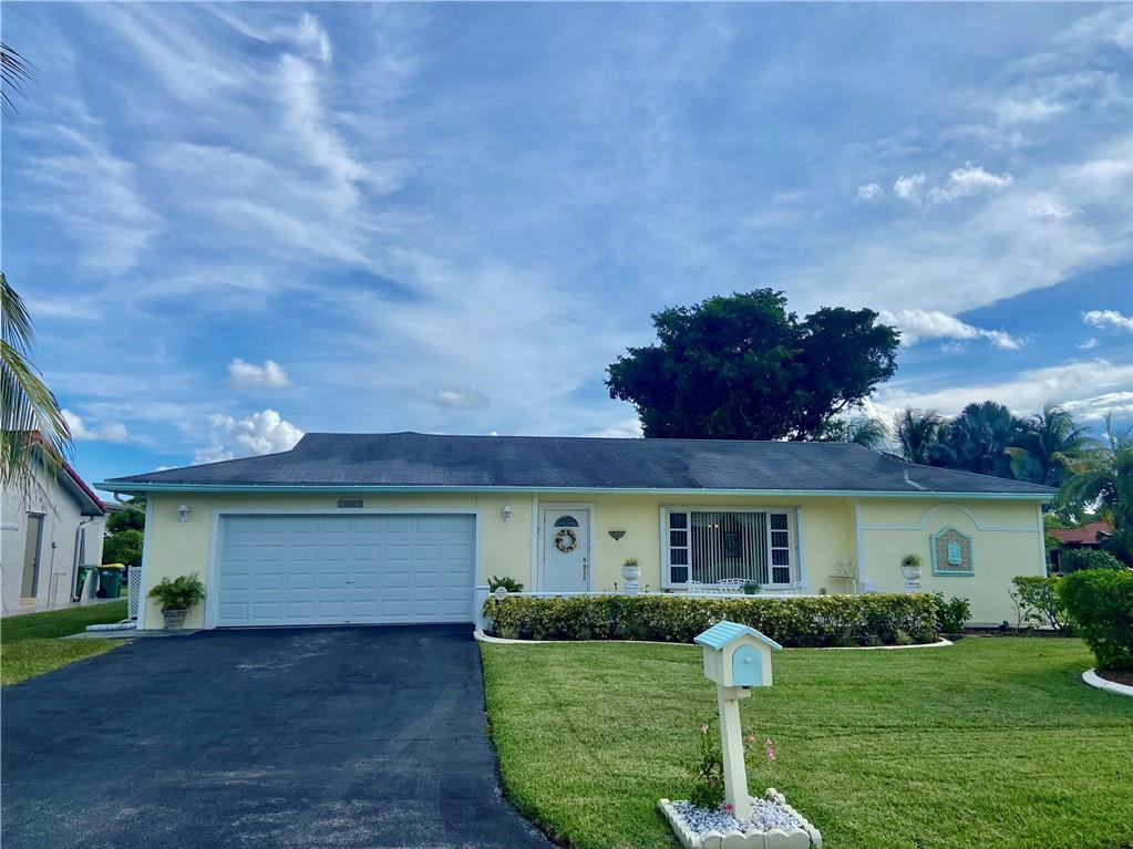 This home is located in a well maintained community. Very low HOA fee includes community pool and rentable clubhouse for entertaining. Large living area with separate living room, dining room, eat in breakfast area and huge Florida room/family room. Home has an updated kitchen with granite countertops. Tile floors throughout the living areas and laminate flooring in the bedrooms. Overextended two car garage with newer installed hurricane rated door. This home is situated on a corner lot and provides lots of yard space with private backyard. Screened in patio for enjoying the cooler days and nights. A couple blocks away is acres of park with trails for outdoor enjoyment. Accordian shutters complete this home for extra protection from storms. Must see!