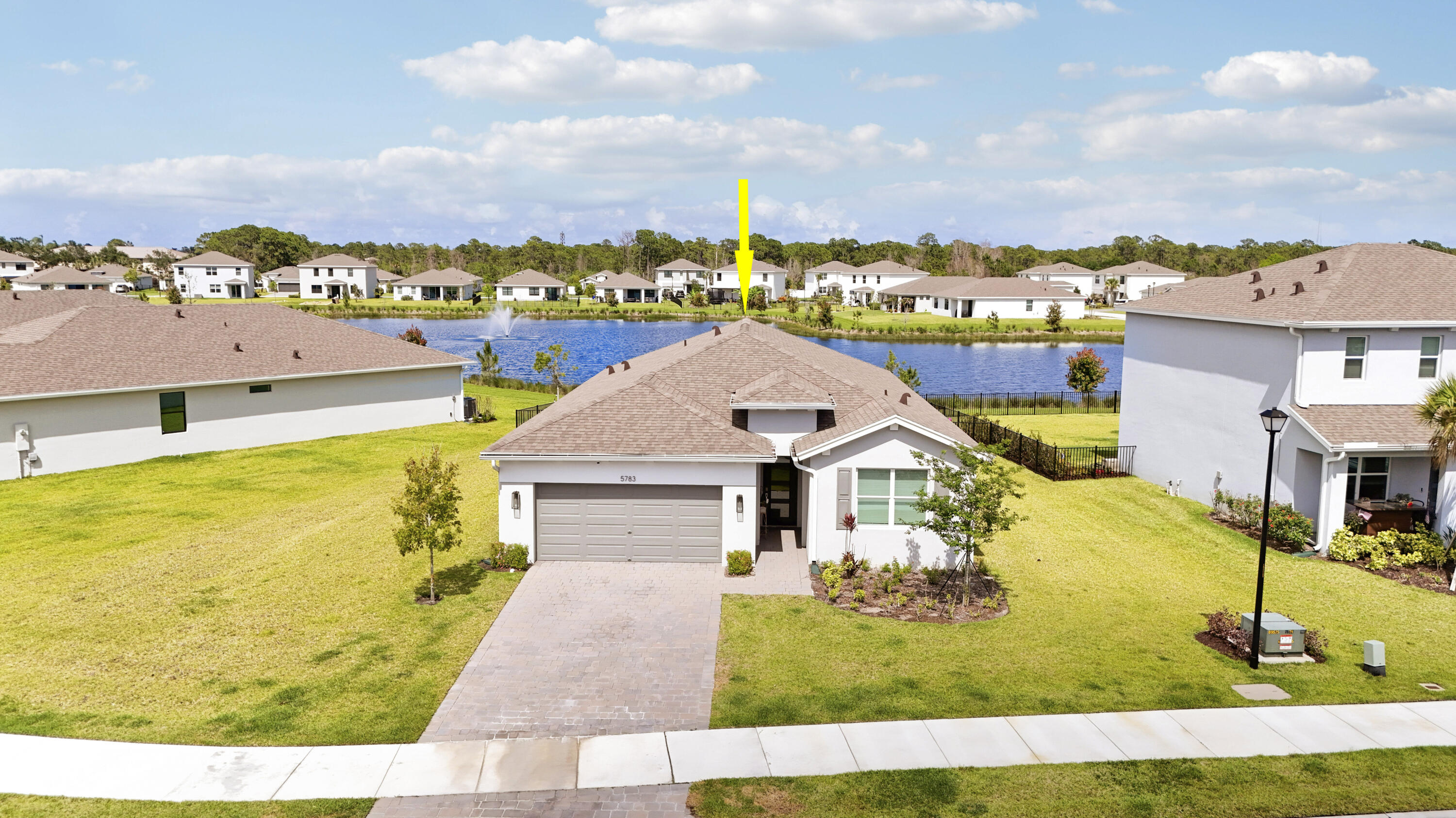 Welcome to this 2024 built CBS 4 Bedroom 2 Bath, 2 car garage home in Kanner Lake. Situated on one of the largest lots in the community (.25 acre). Stunning lake and fountain views with constant NE balmy breezes. Featuring volume ceilings, consistent wood look tile flooring throughout. This home is light, bright and open! The beautiful kitchen includes white shaker cabinets, quartz counters, stainless steel appliances and a walk-in pantry. The large primary suite overlooks the lake, walk in closets, dual sink vanity and large walk in shower. The large back yard is fenced so there is plenty of room for a swimming pool and kids /pets to play. Other upgrades to the home feature recessed lighting and ceiling fans throughout. An inside laundry and extra closets, impact glass windows and sliders