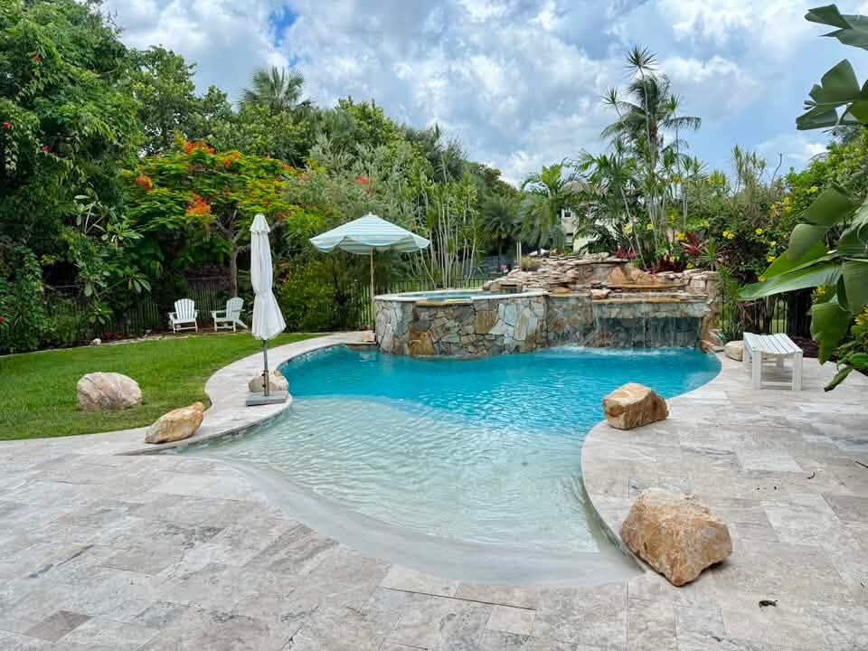Welcome to this stunning waterfront cul-de-sac single-family residence in the prestigious Bridges community of Delray Beach! This two-story home boasts 4,331 sq. ft. of living space, featuring five spacious bedrooms and five full bathrooms. The three-car garage w/polymer floors is equipped w/2 EV chargers & Gladiator wall panel system.  Marble floors grace the main level, while rich engineered wood extends throughout the upstairs. Custom resort-style salt water heated pool & elevated spa has beach entry, swim jets & is graced by a travertine pool deck! It is a one-of-a-kind pool! Crown molding, wet bar off the living room, custom wall-units in family room & media room w/fully functional recliners & cabinet storage & TV's & 7.1 surround sound!   The house is powered by solar panels (paid off) and tesla batteries & back-up whole house generator. Full house water softener! Video surveillance system w/8 high resolution night vision cameras & digital recording. Extensive landscaping featuring gumbo limbo's & plumerias! Custom summer kitchen w/4 burners, sink, fridge & storage. All closets are built-in from the container store. Screened in veranda off primary bedroom is perfect for enjoying your coffee in the morning! The neighborhood features a full-service restaurant, tennis & pickleball courts, pro shop, gym, exercise classes, full indoor basketball court, indoor card room & playroom, heated pool & spa & 24-hour security. Don't miss this opportunity to live in an amazing home!