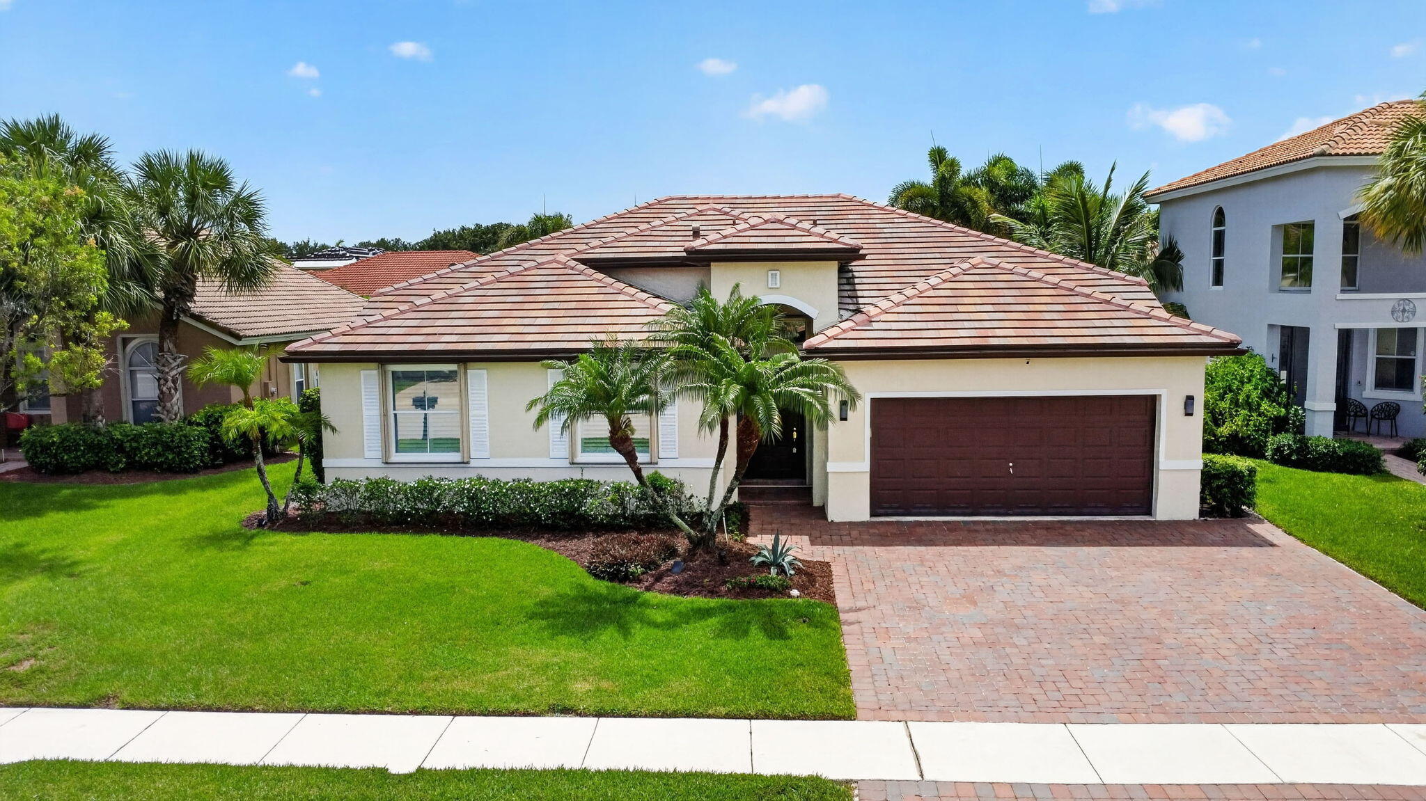 Welcome to a beautifully updated four-bedroom home plus versatile den/office, offering space, comfort, and resort-style living in a desirable manned-gated community. The true showpiece of this home is the spectacular expanded chef's kitchen. Designed to impress, the kitchen features a massive quartz island, stainless steel appliances, beverage refrigerator, abundant cabinetry including stacked upper cabinets with glass-front displays, two pantries and pullout drawers. Whether preparing everyday meals, hosting friends, or gathering around the island, this kitchen is truly the heart of the home. Step outside and discover your own private backyard retreat, complete with a sparkling pool, travertine pool deck, waterfall feature, outdoor shower, fully fenced yard, and    storage shed. It's the perfect setting for relaxing, entertaining, and enjoying the South Florida lifestyle year-round.  Located in a manned-gated community offering 24/7 security, plus an expansive clubhouse with on-site management, tennis, pickleball, fitness center with weight and cardio rooms, banquet room with kitchen, card room, basketball, volleyball, ball field, and tot lot.  A beautifully maintained annual rental offering an exceptional kitchen, private pool, spacious living, and resort-style community amenities.