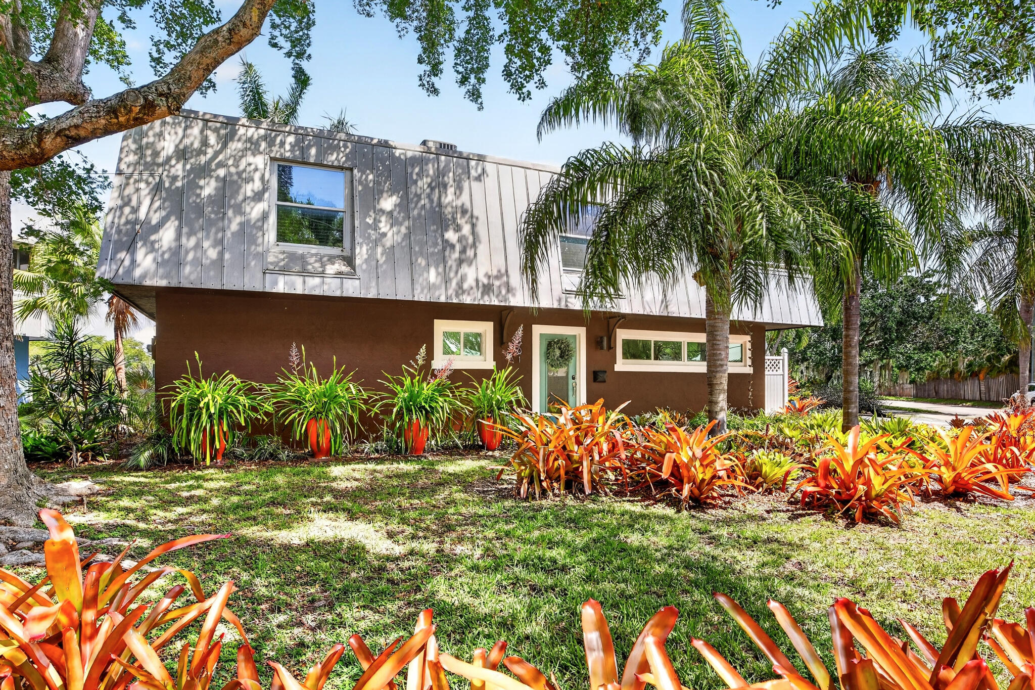 CORAL HEIGHTS KIMBERLY LAKE VILLAS . Tucked into a tropical lakefront setting, this corner-lot two-story SINGLE-FAMILY LAKEFRONT HOME offers approx. 60 ft of lake frontage and peaceful water views that bring calm into everyday living. Main level features a bright living room, dining area with built-in coffee bar/hutch, updated kitchen with granite counters, white cabinetry, stainless appliances, IMPACT WINDOWS/DOORS, and 34' waterfront balcony. Upstairs offers loft living with wet bar, full bath with double sinks and laundry, guest bedroom, primary bedroom, abundant storage, and EXPANSIVE SUNLIT UPPER-LEVEL TERRACE for dining, lounging, and entertaining. Easy access to WILTON MANORS, Oakland Park dining, Downtown FTL, and beach. $75/mo Facility Sharing Agreement includes pool/clubhouse. **Kimberly Lake Villas are single-family homes. The recorded Facility Sharing Agreement provides villa owners with access/use rights to certain shared amenities, including the pool/clubhouse, with a current $75/mo shared-facility fee. The condominium association does not govern the villas, and has no traditional HOA rules, architectural control, buyer approval, or association oversight**