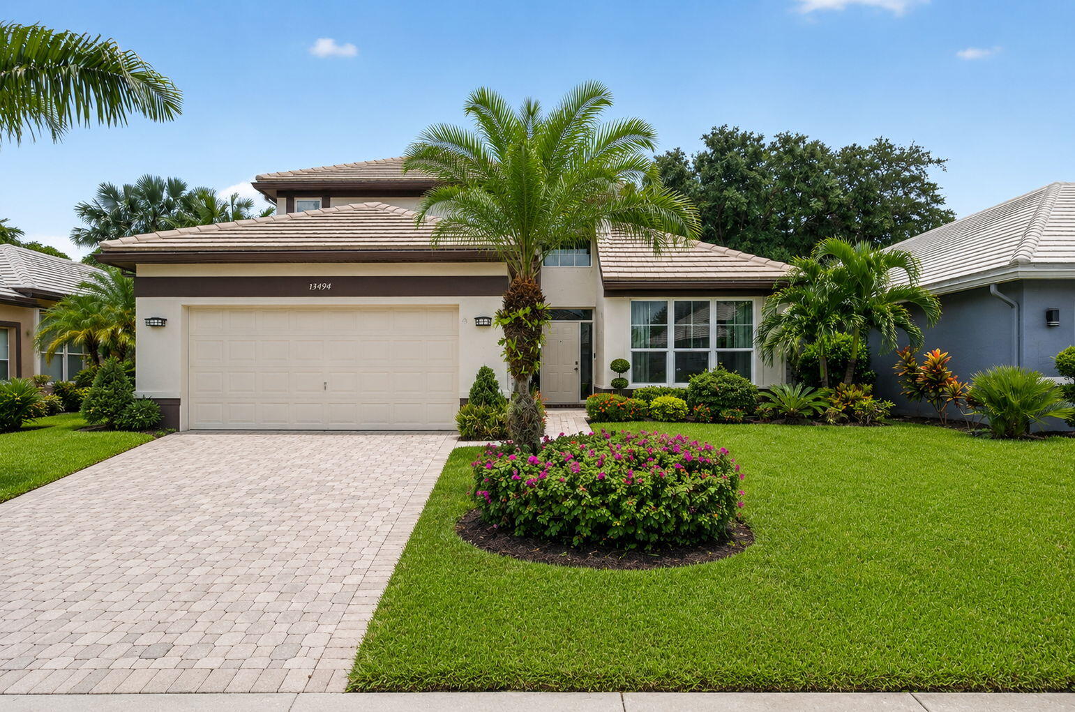 Welcome to this exceptional 2 story single family residence nestled within the highly sought after Polo Trace ALL AGE community of Delray Beach. Featuring 4 bedrooms, 2.5 bathrooms, and 2,398 square feet of well-designed living space, this home offers the perfect blend of comfort, style, and everyday functionality. Thoughtfully maintained and updated, the property includes a 2019 roof, tankless water heater, and mostly impact glass windows for added peace of mind. Additional features include a dedicated laundry room, 2 car garage, and ceiling fans throughout. Surrounded by lush tropical landscaping, mature palm trees, and a beautifully paved driveway, this home boasts outstanding curb appeal and welcomes you from the moment you arrive. Upon entering, you'll be greeted by soaring vaulted ceilings, an abundance of natural light, and an open concept living area highlighted by a dramatic arched window and stylish tile flooring throughout the main living spaces. The inviting layout creates the perfect setting for both everyday living and entertaining. The well appointed kitchen features rich wood cabinetry, granite countertops, a decorative mosaic tile backsplash, stainless steel appliances, and a spacious center island with a built in sink and breakfast bar seating. Adjacent to the kitchen, a charming breakfast nook surrounded by large windows provides the ideal space to enjoy your morning coffee. The 1st floor primary suite offers a private retreat with warm wood flooring and direct access to the outdoor living area through sliding glass doors. The luxurious ensuite bathroom features a large jetted soaking tub beneath a glass block window, a separate glass enclosed shower, and a dual sink vanity. Upstairs, you'll find 2 spacious guest bedrooms along with a versatile loft area that can easily serve as a 4th bedroom, home office, media room, or additional living space. Built in shelving adds both character and functionality. One of the home's standout features is the bright and airy sunroom, complete with skylights, ceiling fans, and a tiki style bar, creating the perfect space for entertaining guests or simply relaxing year round.  Beyond the home itself, Polo Trace delivers one of Delray Beach's most sought after resort style lifestyles. Residents enjoy access to a spectacular 26,000 square foot clubhouse that serves as the social centerpiece of the community. The beautifully designed clubhouse features elegant gathering spaces, card rooms, social lounges, meeting rooms, and a state of the art fitness center equipped with strength training and cardio equipment. Residents can also enjoy an on-site RESTAURANT and bar, making it easy to meet friends, attend social events, or enjoy a casual meal without leaving the community. Outdoor amenities are equally impressive and designed to accommodate every lifestyle. The resort style pool features expansive sun decks, private cabanas, shaded seating areas, and a relaxing atmosphere surrounded by lush tropical landscaping. Additional outdoor gathering areas include fire pits, covered dining spaces, and beautifully maintained walking paths throughout the community. For those who enjoy an active lifestyle, Polo Trace offers multiple Har Tru bocce, tennis & PICKLEBALL courts, and a full calendar of fitness classes, leagues, and social activities. Families and guests will appreciate the playground, open green spaces, and scenic lakes that enhance the community's picturesque setting. Ideally located in the heart of Delray Beach, Polo Trace places residents just minutes from world renowned Atlantic Avenue, known for its vibrant dining, shopping, art galleries, entertainment, and nightlife. Beautiful South Florida beaches, championship golf courses, major highways, airports, and top-rated medical facilities are all conveniently nearby, providing the perfect balance of luxury, convenience, and recreation.