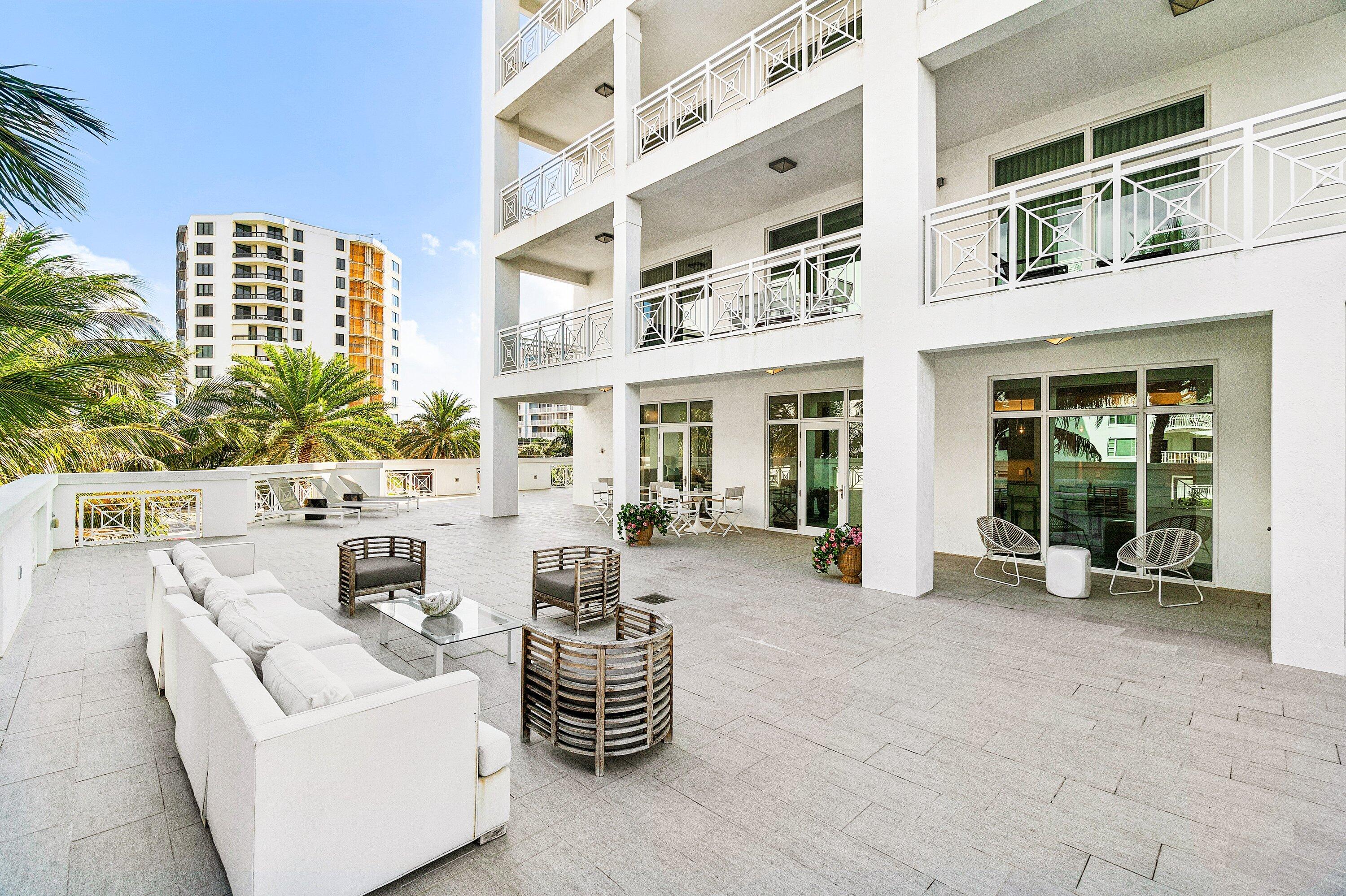 New Price! $2,995.000. Discover an elevated standard of coastal living in this exceptional three-bedroom, three-and-a-half-bath residence, located within an exclusive boutique building consisting of only 19 residences. Completed in 2016, the property offers over 3,500 square feet of impeccably designed interior space, complemented by a remarkable 4,000+ square foot wraparound terrace creates an ultra luxurious indoor-outdoor lifestyle. A private elevator opens directly into the residence, where refined architectural lines, curated finishes, and sun-filled interiors set an immediate tone of sophistication and ease. The expansive living, dining and family room areas are framed by walls of floor-to-ceiling glass, seamlessly connecting to the terrace and showcases water views.