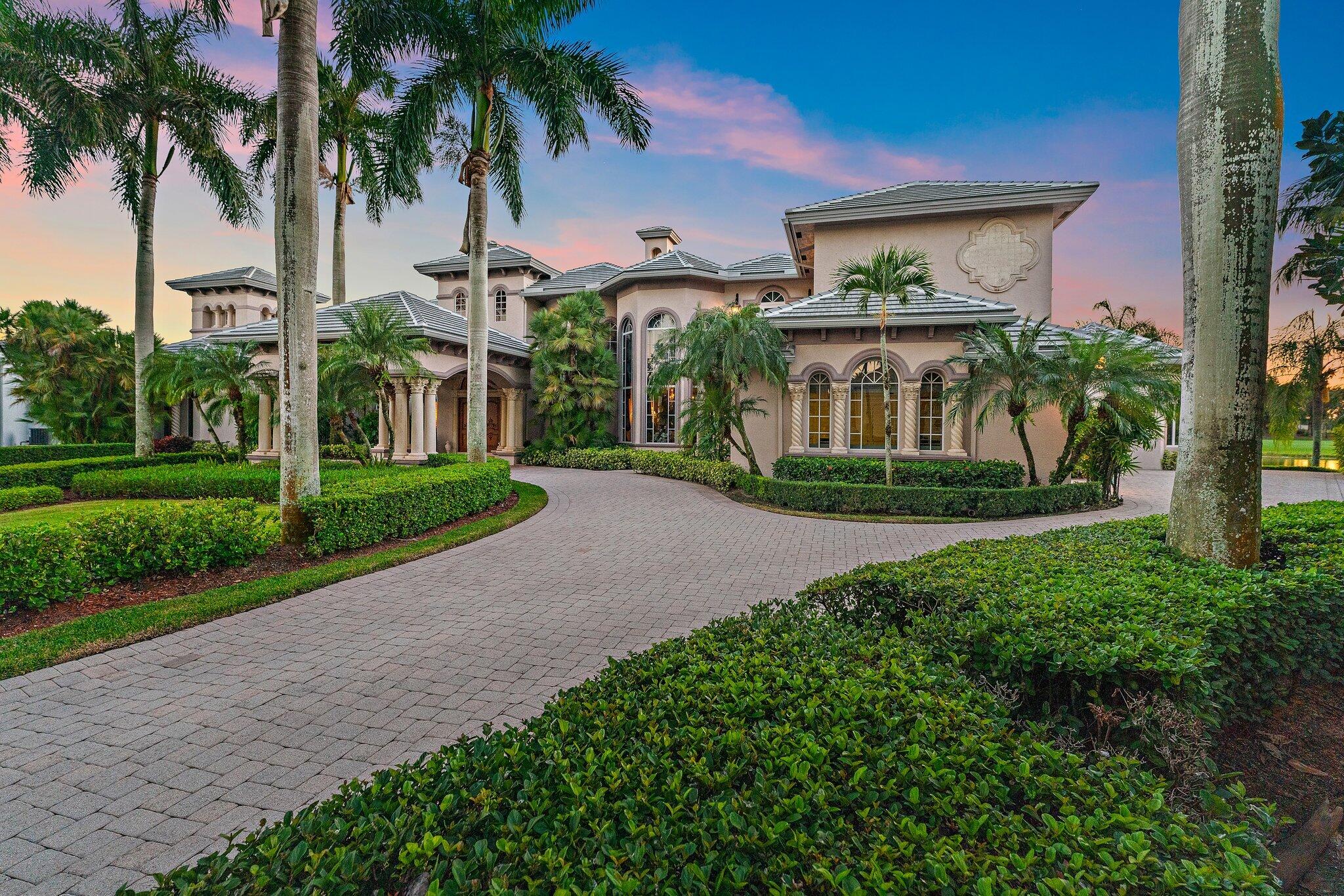 Discover European-inspired elegance and unmatched luxury in this extraordinary estate located in the prestigious, award-winning Ibis Golf & Country Club in West Palm Beach. Set on an expansive two-third-acre cul-de-sac lot with 250 feet of pristine lake frontage, this architectural masterpiece offers sweeping, unobstructed views of shimmering water and manicured fairways. A grand circular drive with porte-cochere welcomes you to the residence, where hand-carved double mahogany doors open to a dramatic marble foyer framed by soaring ceilings and arched windows that capture panoramic golf and lake vistas. Built by Cribb Construction and designed by Fran Murphy Interiors, this home showcases exceptional craftsmanship and timeless European opulence throughout its 8,758 square feet of air-conditioned living space (10,765 total). The gourmet chef's kitchen is a culinary showpiece, offering custom cabinetry, a Sub-Zero refrigerator/freezer, Viking stove cooktop, double Thermador ovens, and two Bosch dishwashers. The elegant formal dining room is ideal for entertaining. Among the five bedrooms, the expansive owner's suite is a serene retreat boasting peaceful lake and Golf course views, two walk in custom closets as well as separate his and hers water closets. Her water closet has a private makeup vanity, while his water closet has a library book case. A sweeping marble staircase leads to the second level, revealing a massive club room/office with a custom marble fireplace and wet bar, a theatre room, library and an additional en-suite bedroom, providing an exceptional layout. Outdoor living is elevated to resort standards featuring a spectacular 60-foot pool and swim-in grotto with waterfall overlooking a half-mile lake view and the picturesque fairways beyond. Additional conveniences include a whole-home water purification system, instant hot water, impact windows and doors and a new 2025 roof for peace of mind. Residents of Ibis enjoy access to a world-class lifestyle, including a 90,000-square-foot clubhouse, three Nicklaus-designed 18-hole championship golf courses, five dining venues, a state-of-the-art fitness center and spa, a resort pool, a separate lap pool, tennis and pickleball facilities as well as a separate park within the Ibis Community which includes a children's playground with swings and recreation equipment, a barbeque area, bocce court and a dog park for our canine family members Ibis is surrounded by 13,000 acres of county dedicated forever preserve land providing the community with security and serenity. Ibis is a distinguished member of The Platinum Club of America and has also been awarded a Distinguished Emerald Club of the World with elite status by Boardroom Magazine, which is one of the most respected trade publications serving private clubs. This remarkable estate offers the perfect blend of luxury, craftsmanship, and breathtaking surroundings, offering an exceptional opportunity in one of Palm Beach County's most coveted private club communities.