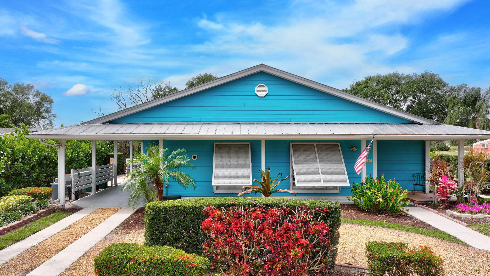 Maximize your ROI: Your Tropical Oasis in the Heart of the New Sandpiper Bay! Experience the ultimate Florida lifestyle in this Key West-style residence. The owner has cared for this extensively remoded home in 2001. Perfectly designed for multi-generational living or currently a high-performing vacation rental, the home features a flexible floor plan with two kitchens and dual laundry areas.   Step outside to your private sanctuary: a heated resort-style pool (with a 2022 pump) surrounded by lush, tropical landscaping. Inside, enjoy coastal charm, impact windows for peace of mind, high end appliances and spacious rooms. Located in the rapidly evolving Sandpiper Bay, minutes from Hutchinson Island beaches and close to downtown Stuart, Jensen Beach, golf, shopping and everyday amenities.  Located <1 mile from two golf courses and minutes from the new VOCO All-Inclusive Resort and the New Port District entertainment hub. No HOA—bring your boat/RV.