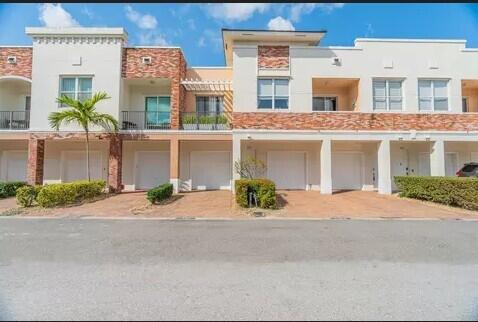 Ask about 6 free mos of HOA dues! Easy worry-free living in the heart of Tradition. Beautiful, modern, light and bright unit has been meticulously maintained and boasts unique features like exposed brick and gorgeous granite countertops. You'll enjoy plenty of storage with two closets in the primary bedroom, and a primary bathroom with a deep tub and a separate spacious, beautifully tiled shower. Relax or entertain on either of two private balconies, take a short walk to the community pool, and walk or ride a bike to the multitude of shops, restaurants, and festivities in Tradition. This condo also has a one-car attached garage with ample room to park a car, and plenty of room for storage. No back-breaking yardwork or projects here! Come see why this beautiful home should be yours today!