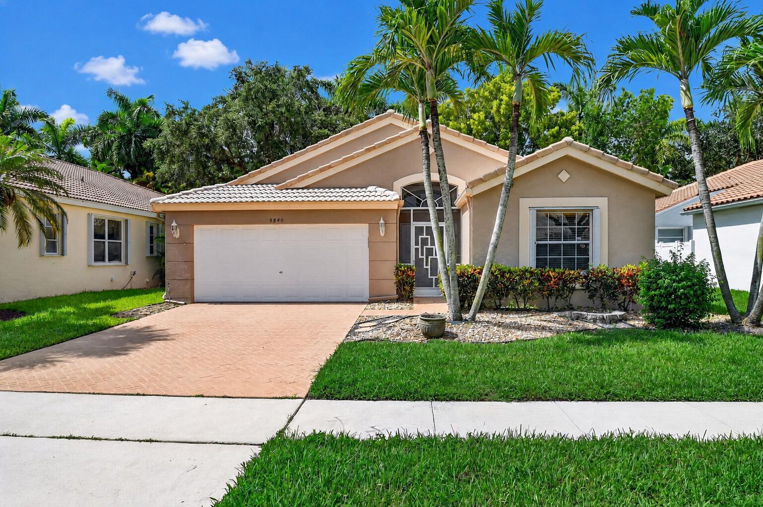 Welcome to this well-maintained 3-bedroom, 2-bath home with a 2-car garage, located in the highly sought-after Palm Isles West community. This home offers a wonderful opportunity to move right in or personalize it over time to match your vision! The thoughtfully designed floor plan features spacious living areas, flawless tile flooring throughout, and an oversized covered and screened patio which is perfect for enjoying Florida's beautiful weather, entertaining friends, or simply relaxing with your morning coffee. Recent updates include a new A/C, new water heater, and a brand-new refrigerator, providing valuable peace of mind while leaving plenty of opportunity to add your own personal touches!  Palm Isles West is known for its exceptional active adult lifestyle and recently completed state-of-the-art clubhouse featuring resort-style amenities, cafe, multiple swimming pools, pickleball and tennis courts, fitness facilities, card rooms, social clubs, entertainment, and countless activities. Conveniently located near shopping, dining, beaches, and major highways, this is your chance to enjoy one of Boynton Beach's premier 55+ communities. Whether you're looking for a full-time residence or a seasonal retreat, this home offers solid value, an excellent layout, and the opportunity to make it truly your own! Welcome Home!