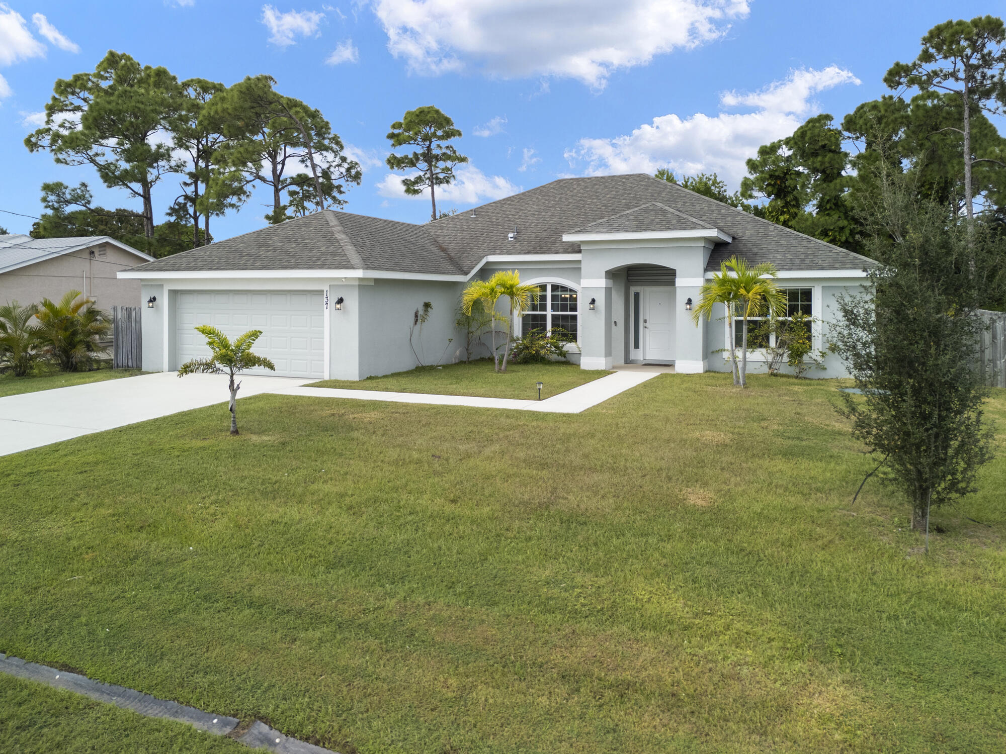 Completed in November 2021, this beautifully maintained CBS home offers a rare and highly desirable three-way split floor plan, thoughtfully designed to provide exceptional privacy without sacrificing open, connected living spaces. Featuring 4 bedrooms plus a dedicated den, 3 full bathrooms, a 2-car garage, covered lanai, and a convenient cabana bath, this move-in-ready residence has been barely lived in and shows like new.  Designed with both everyday living and entertaining in mind, the spacious layout offers formal and casual living areas, a separate formal dining room, a generous family room, and a bright breakfast nook overlooking the backyard. At the heart of the home, the beautifully appointed kitchen features 36-inch wood cabinetry with crown molding, Whirlpool stainless steel appliances, abundant counter space, and ample storage.  The private primary suite is complete with dual vanities, a soaking tub, separate walk-in shower, and an oversized walk-in closet. The home's unique split-bedroom design provides ideal separation for family members, guests, or a home office, making it a floor plan that is rarely available and highly sought after.  Ideally located just off Crosstown Parkway, you'll enjoy convenient access to top-rated schools, shopping, dining, parks, and local entertainment while still enjoying the comfort of a quiet residential setting. Built in 2021 and meticulously maintained, this exceptional home offers the perfect combination of modern construction, functional design, and everyday convenience.