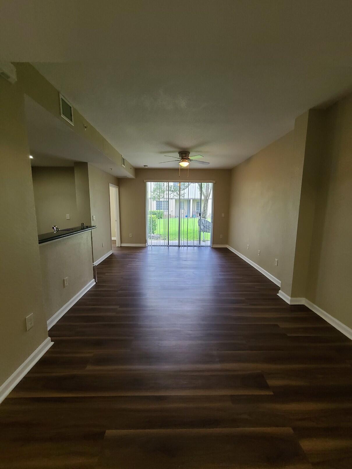 Welcome to the highly sought-after, man-gated Marsh Harbor community! This spacious 2-bed, 2-bath first-floor unit features elegant laminate flooring and a modern kitchen with stainless steel & black appliances. Conveniently located near beaches, I-95, and the Florida Turnpike, offering easy access to everything you need. Enjoy resort-style amenities, including a gym, pool, clubhouse, playground, and more! Don't miss this opportunity—schedule your showing today