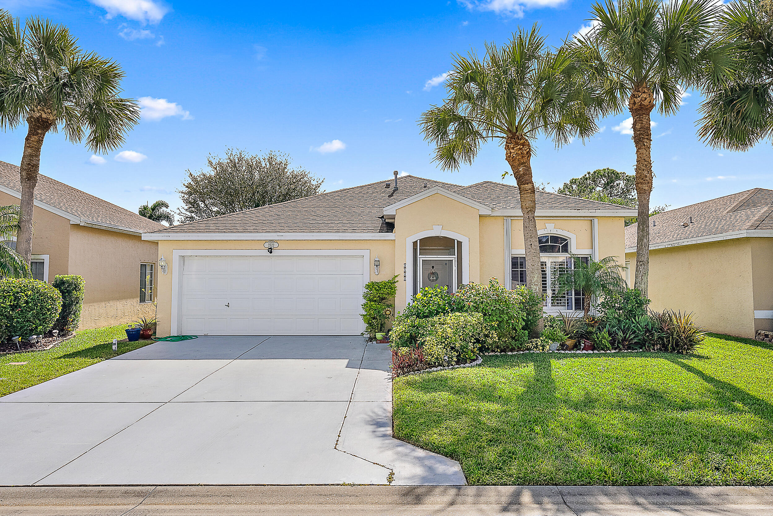 This beautifully maintained 3-bedroom, 2-bath home is located in the gated community of Springtree in Stuart. Inside, you'll find a bright, open floor plan that seamlessly connects the living, dining, and kitchen areas, creating the perfect space for both everyday living and entertaining. The spacious kitchen features a large center island that's ideal for meal prep, casual dining, or gathering with loved ones. Step outside to a generous screened-in porch overlooking a fully fenced backyard with plenty of room for kids and pets to play. Mature Clusia hedges provide exceptional privacy and create a peaceful, tropical setting.  Conveniently located just minutes from shopping, dining, beautiful beaches, and I-95, Springtree is also part of the highly sought-after Martin County A-rated school district. Offering the perfect blend of comfort, privacy, and convenience, this move-in-ready home is ready to welcome its next owners.