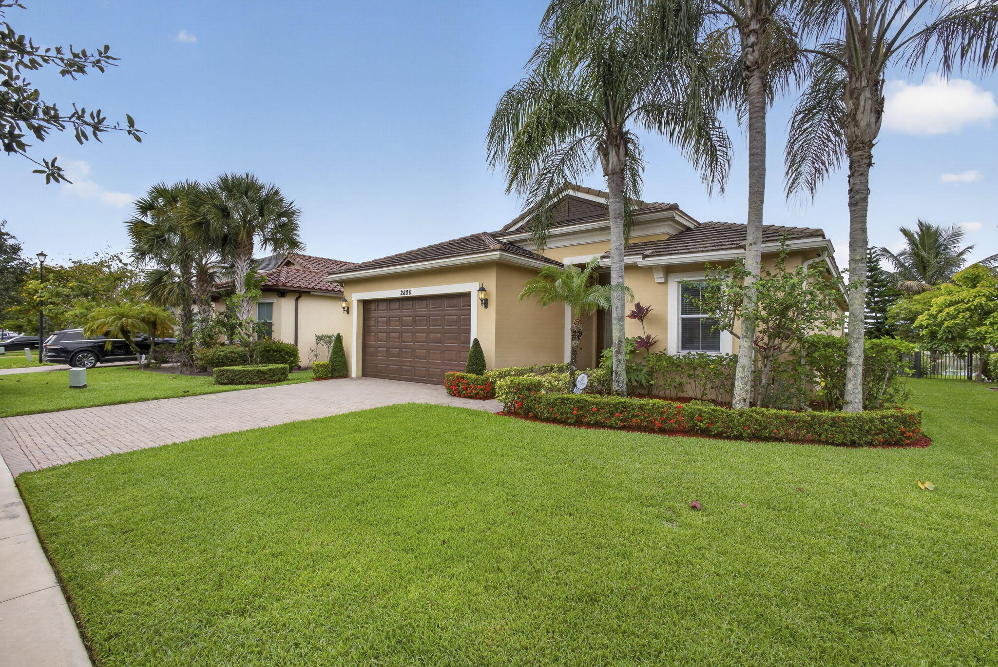 Welcome to Porto Sol, one of Royal Palm Beach's most desirable gated communities! This stunning single-story lakefront home offers 3 bed, 3 full bath, 2,046 sq ft, all tile throughout. Double front door, 2-car garage. Gourmet kitchen with wall oven, cooktop & microwave opens to living, dining, family room & breakfast nook. Master suite with retreat area & built-in closet. Every bedroom has its own bath access. Fresh interior paint. Brand new AC & ductwork — under one year. Step outside to your screened lanai and fall in love with the sunsets over the lake. Resort-style amenities, minutes from Turnpike, 441, hospitals & shopping. 20 min to the beach. Schedule your showing today — this one will not last!