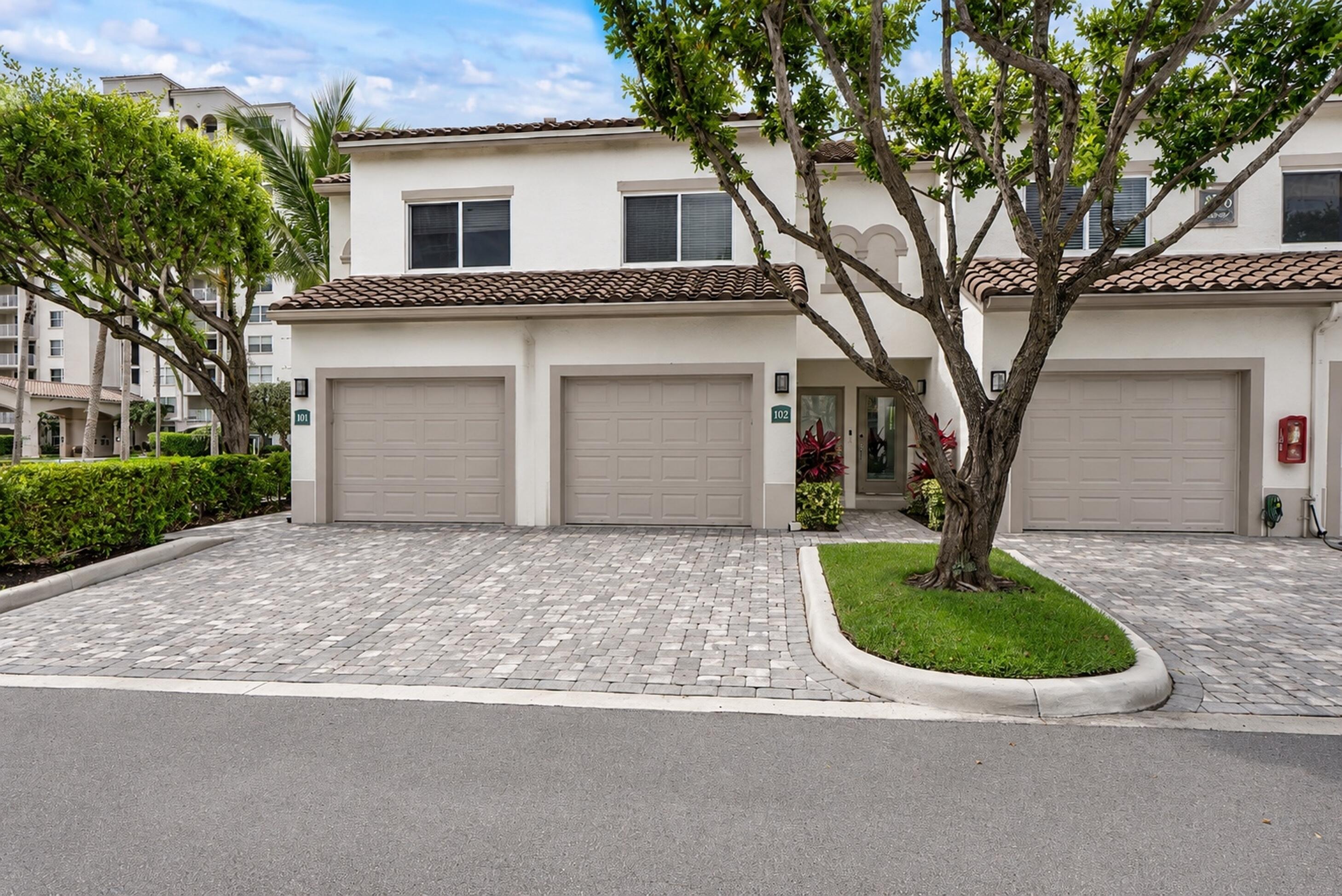 Welcome to coastal elegance in the exclusive Highland Beach Club. This stunning, rarely available, fully renovated 2-bedroom, 2.5-bath 2-story townhouse offers the perfect blend of sophistication, comfort, and effortless beachside living. Thoughtfully designed with impeccable attention to detail, the home showcases a bright, airy interior with refined finishes, impact windows, and a seamless flow throughout. The beautifully updated kitchen features high-end appliances, sleek cabinetry,  modern finishes and plenty of storage. The living area opens to a covered private patio, creating a wonderful indoor-outdoor space to enjoy South Florida living. A custom built-in desk/workspace adds both style and functionality, perfectly integrated into the home. Upstairs, the primary suite offers a serene retreat with its own private balcony, ideal for enjoying morning coffee or coastal breezes. Both bedrooms feature well-appointed, updated en-suite bathrooms. Additional highlights include a spotless private garage, meticulously maintained and offering convenience along with extra storage. Residents of Highland Beach Club enjoy an exceptional resort-style lifestyle with an array of premier amenities, including a newly renovated clubhouse, state-of-the-art fitness center, heated pool, spa, sauna, BBQ area, and a private dock overlooking the Intracoastal. Just steps away, exclusive beach access completes this true coastal experience. This is more than a home—it's a lifestyle defined by luxury, tranquility, and effortless South Florida living.