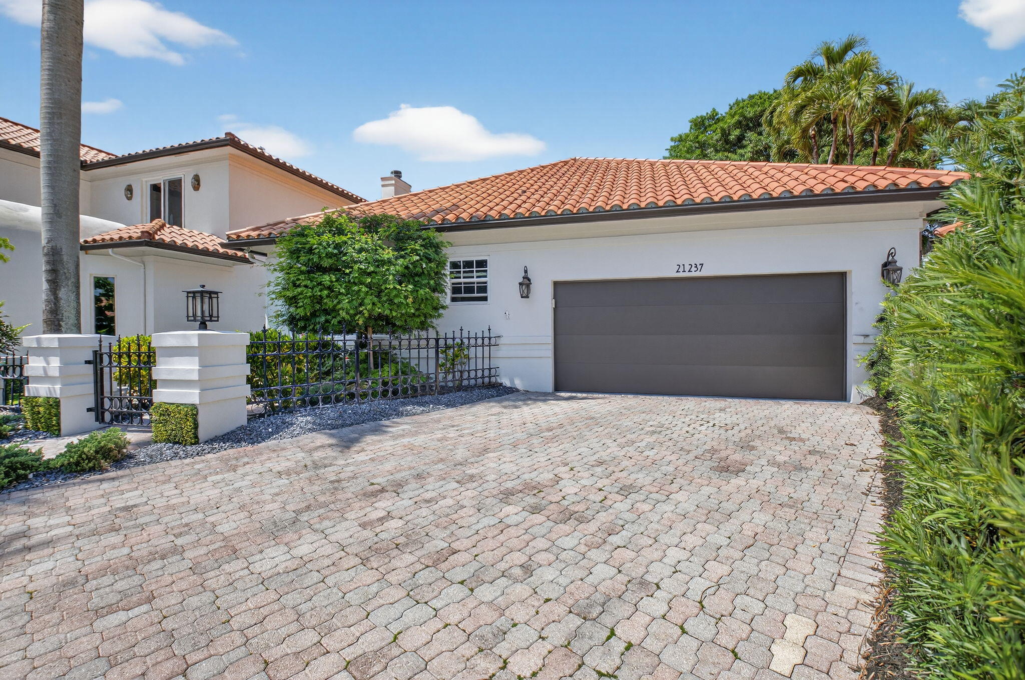 Welcome to this exceptional residence nestled within the prestigious Boca Grove community. Mandatory membership $250,000 required. This beautifully renovated home is truly a "must see," offering a seamless blend of high-end finishes and modern upgrades throughout. Every detail has been carefully curated, beginning with all-new plumbing and electrical systems, impact windows, and a new garage door. Step inside to discover 2,600 square feet of elegant flooring, featuring all-natural travertine tile and rich wood—completely free of man-made materials—creating a warm, timeless aesthetic. The home's three full bathrooms are equally impressive, showcasing premium travertine and marble surfaces throughout. The primary suite is a private retreat, complete with dual showers including a steam unit, an oversized all-stone soaking tub, a marble double-sink vanity, and a heated towel rack. The kitchen is equipped with top-of-the-line Bertazzoni appliances, including a 6-burner gas stove, oven, hood, refrigerator, and dishwasher. Additional highlights include double sinks, dual dishwashers, and stunning Cristallo leathered quartzite countertops and backsplash. Natural gas powers key home features, including the stove, oven, outdoor BBQ, fire pit, tankless water heater, dryer, and a full-house generator. Step outside to a spacious, tranquil backyard overlooking the golf course—perfect for entertaining or simply relaxing with a morning coffee while enjoying the serene views. Beyond the home, residents enjoy access to Boca Grove's exclusive club amenities, including a clubhouse, state-of-the-art fitness center, resort-style pool, tennis courts, pickleball, and padel. Ideally located near fine dining, upscale shopping, and houses of worship, this home offers both luxury and lifestyle in one of Boca Raton's most sought-after communities.